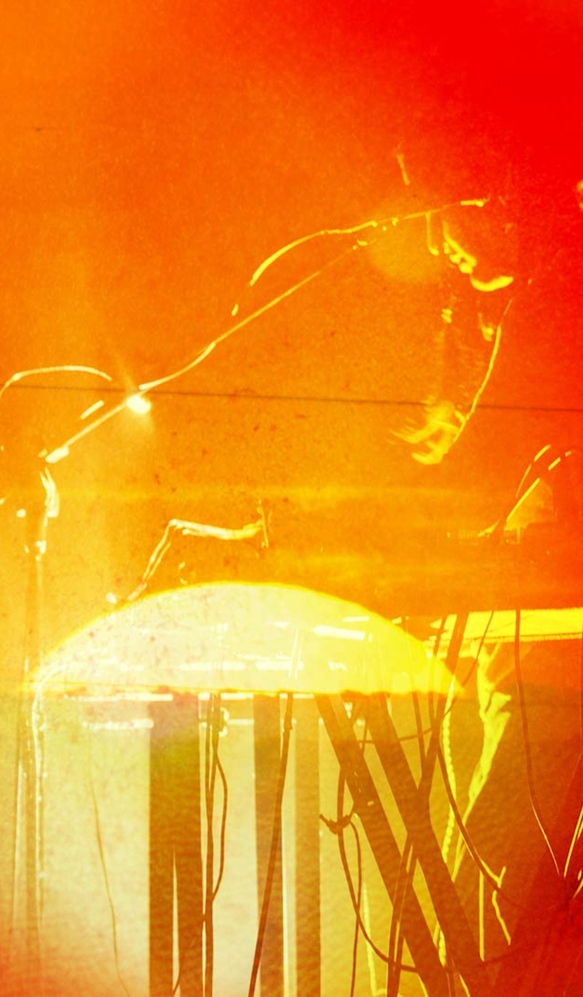 Photo bashed motion image with bright orange sunsets and natural textures over a silhouette of musician Aarti Jadu.