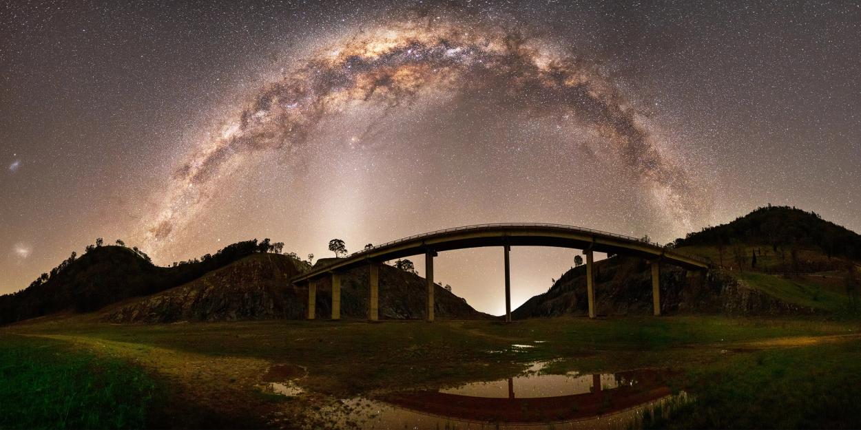 Arcing stars over arched bridge