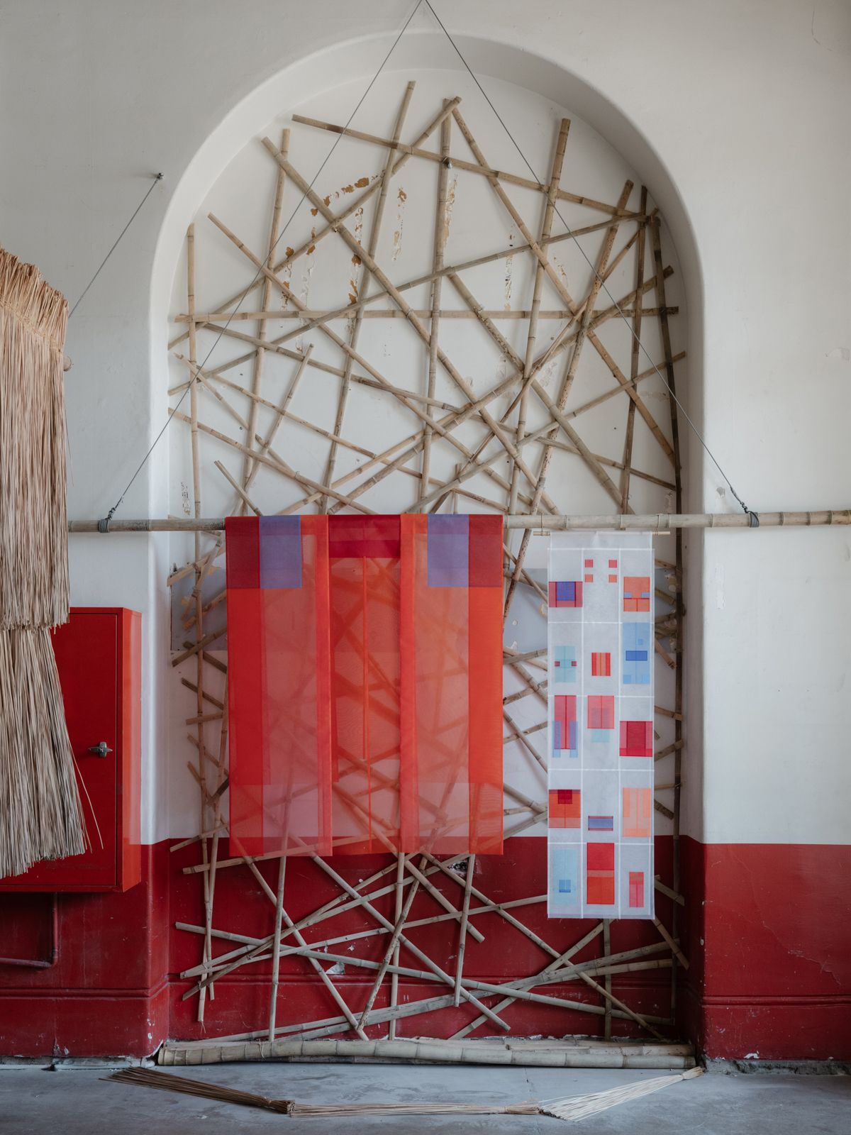 Sheer fabric hanging from bamboo feature