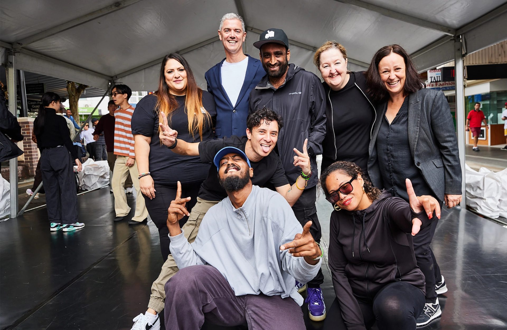 Eight people pose for camera.
