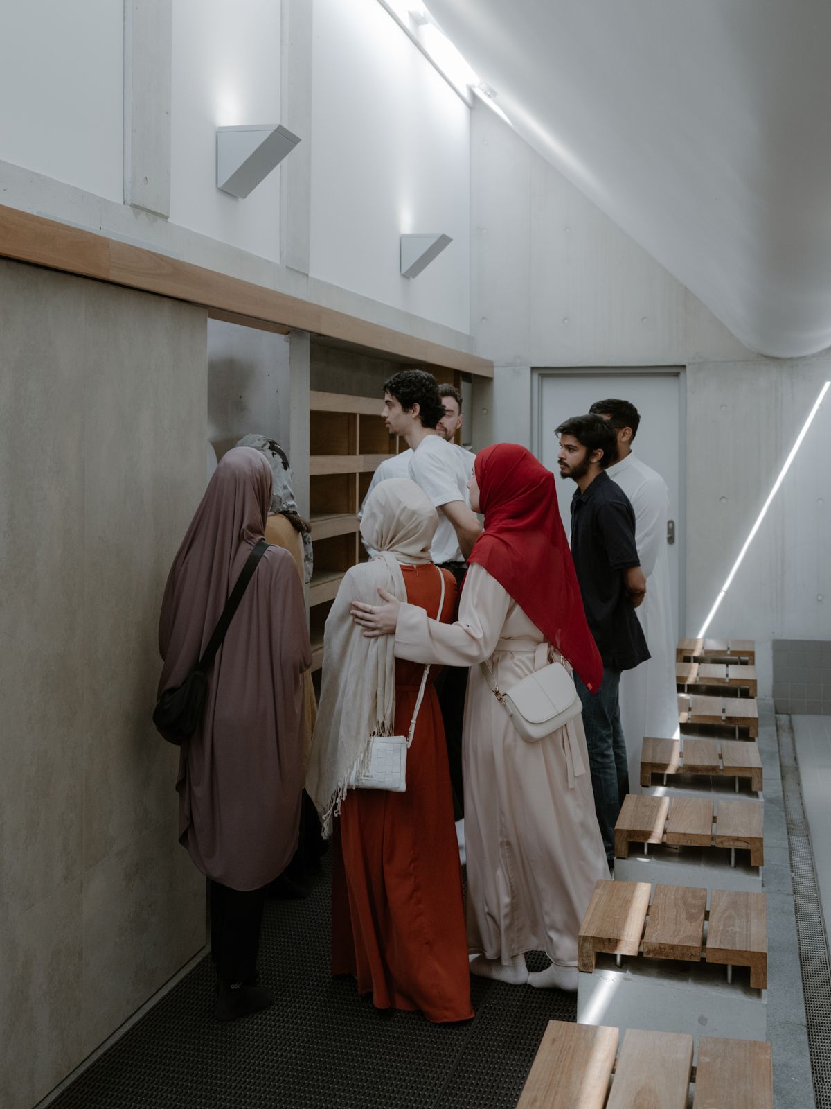 Figures waiting to walk through a doorway while standing