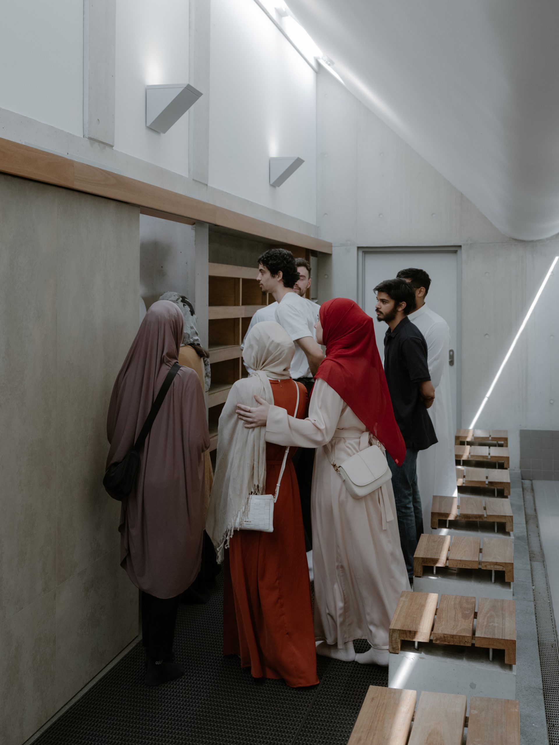 Figures waiting to walk through a doorway while standing