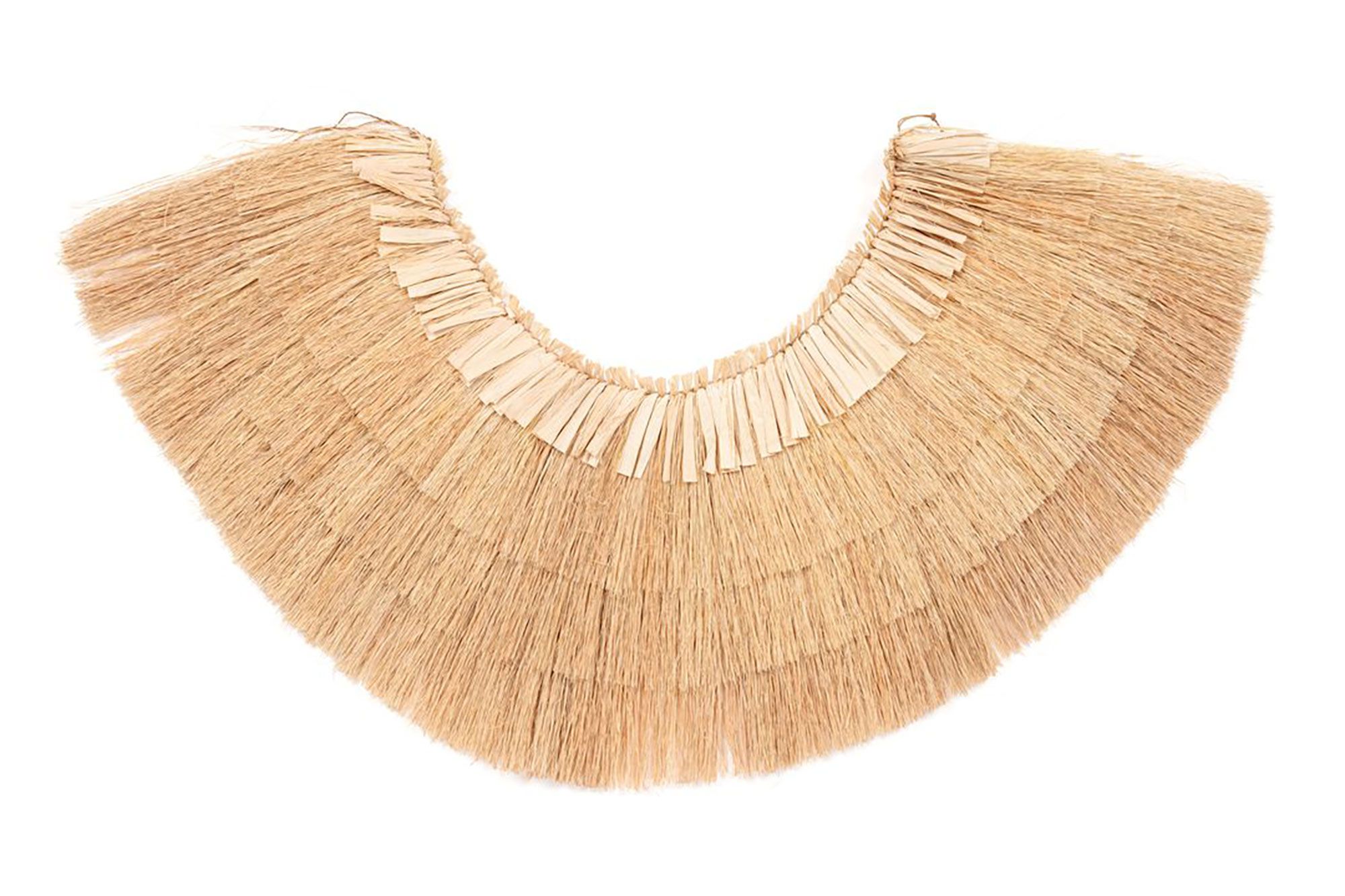 Grass skirt made from four layers of pandanus leaves knotted at the top and fastened by a thread of coconut fibre.