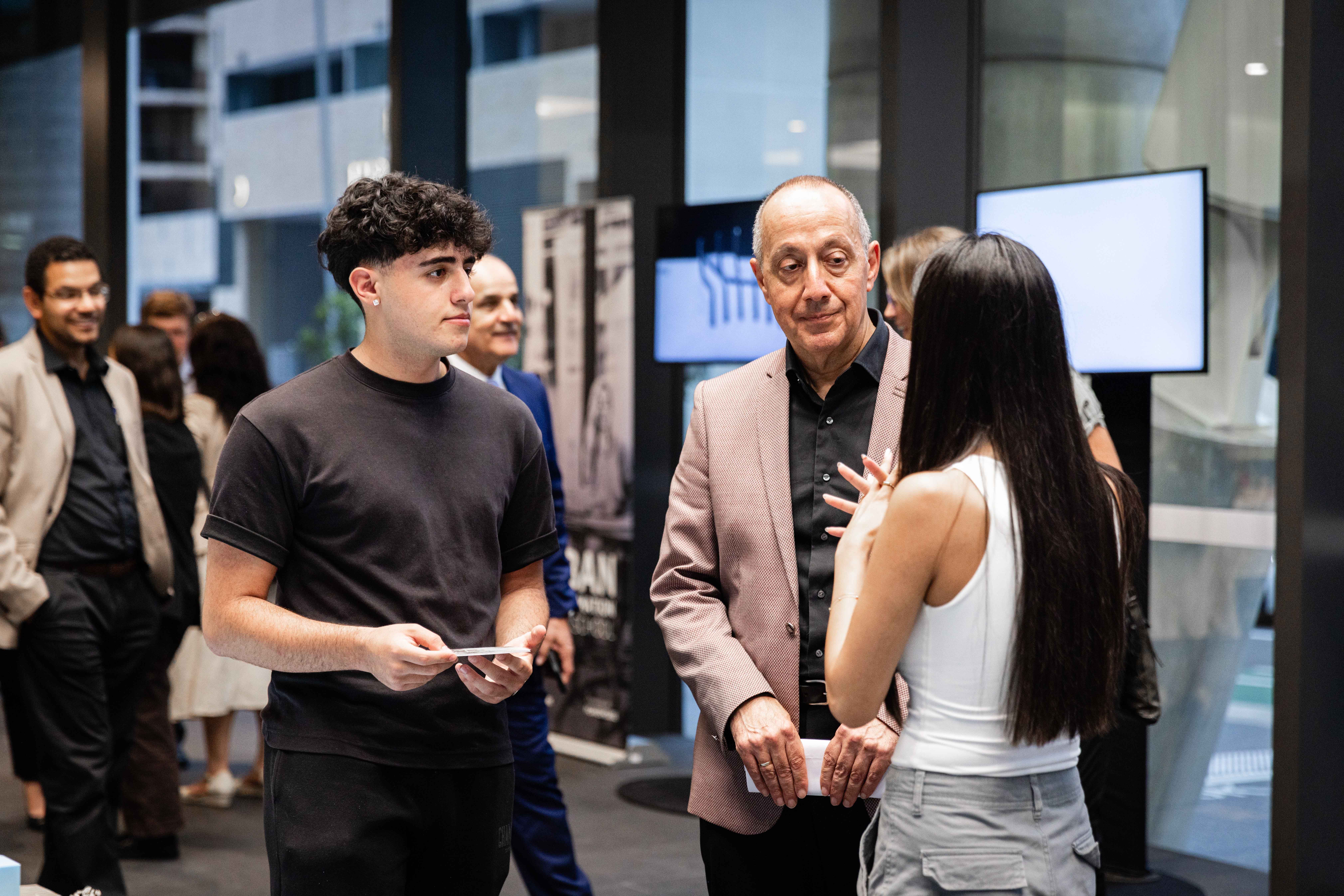 People talking in a window'd room.