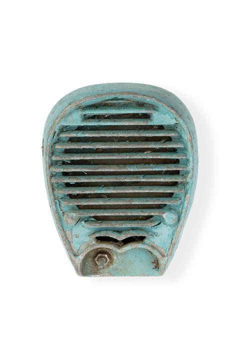 Metal casing painted blue, the casing has rounded edges and a circular grill at the front to allow sound to escape.