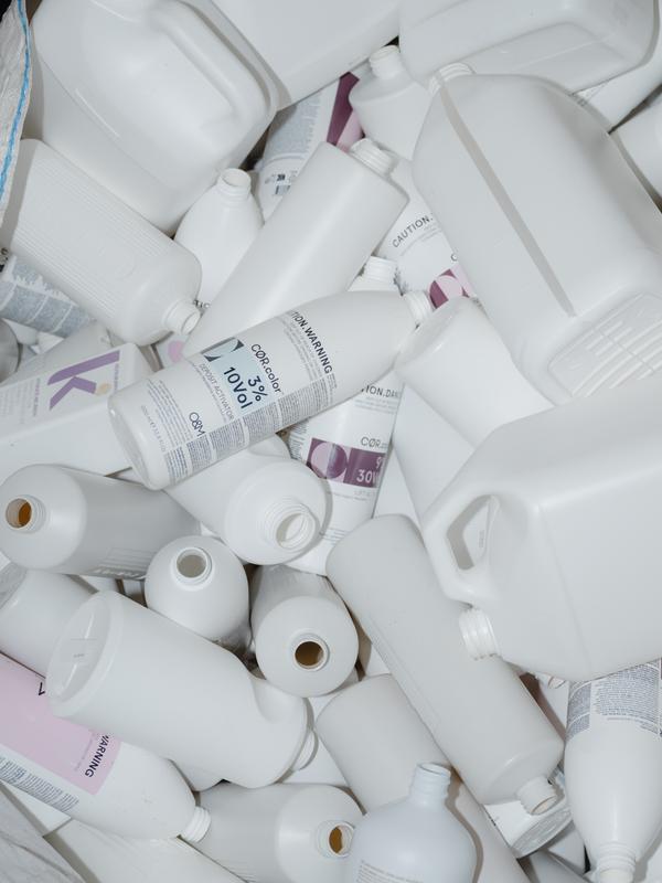 White plastic bottles of varying shapes and sizes.