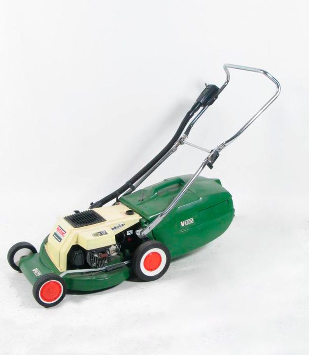 two-stroke lawn mower with electronic starting features a green enamel lower body