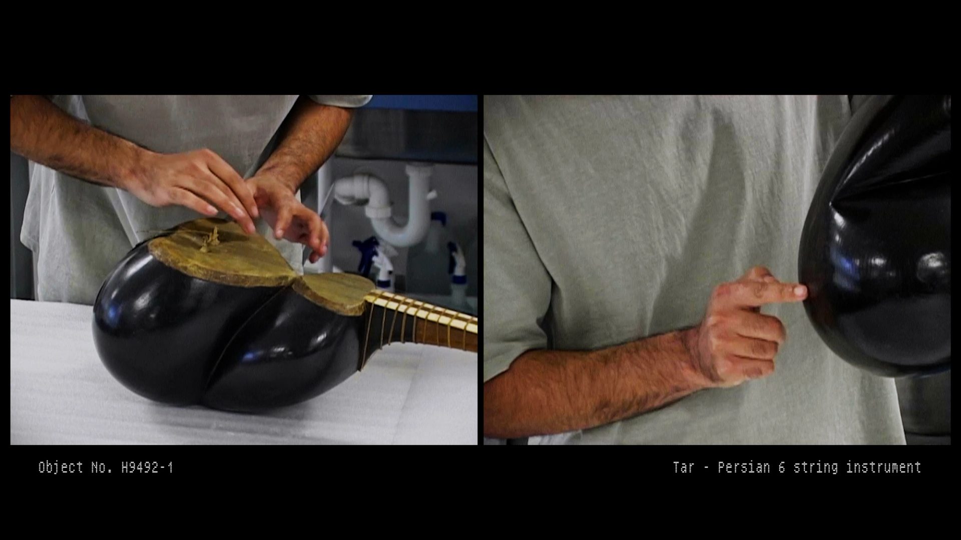 Hamed Sadeghi inspects the Persian tar musical instrument