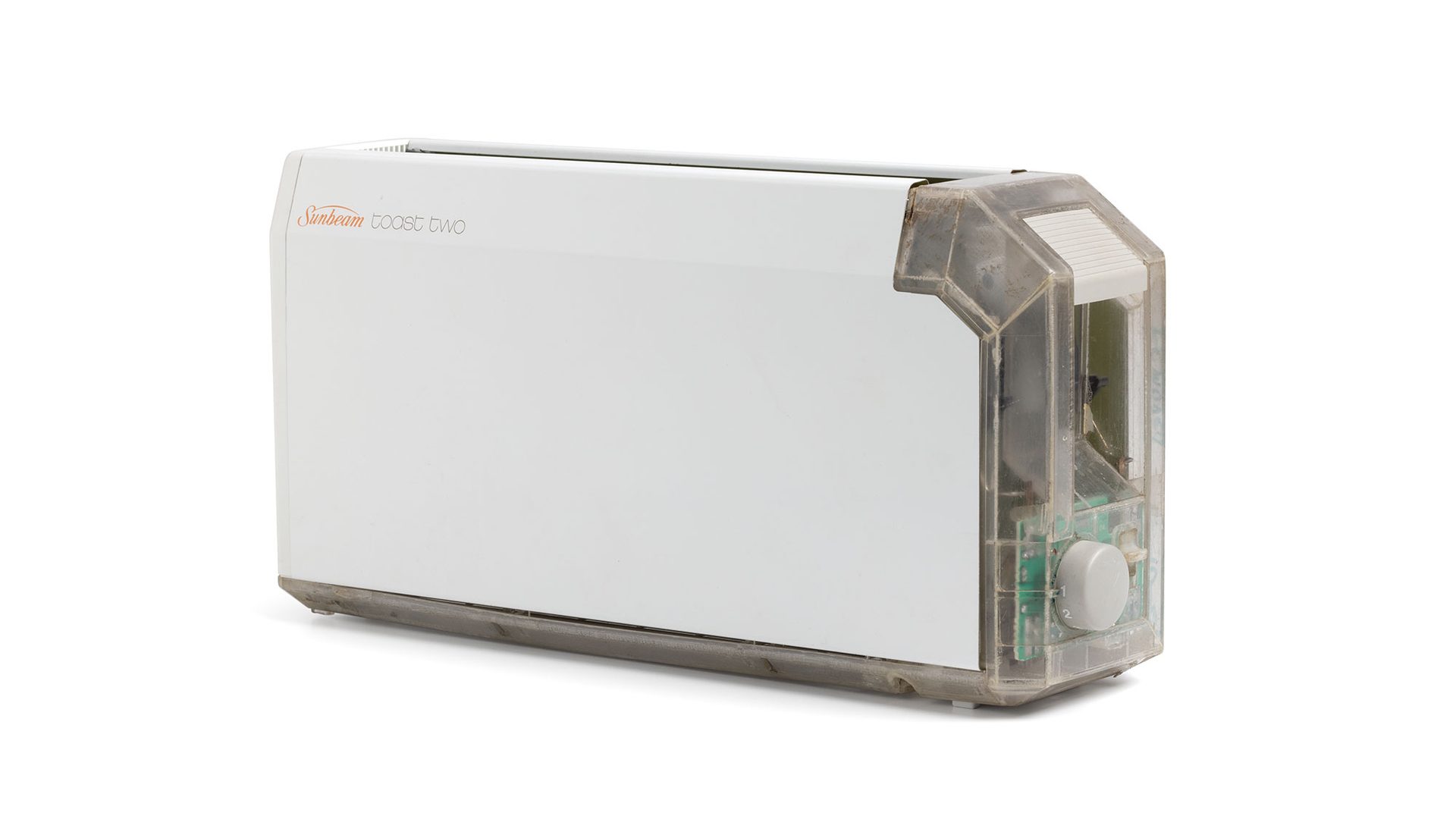 A long and thin white toaster with a clear end showing the internal mechanisms.