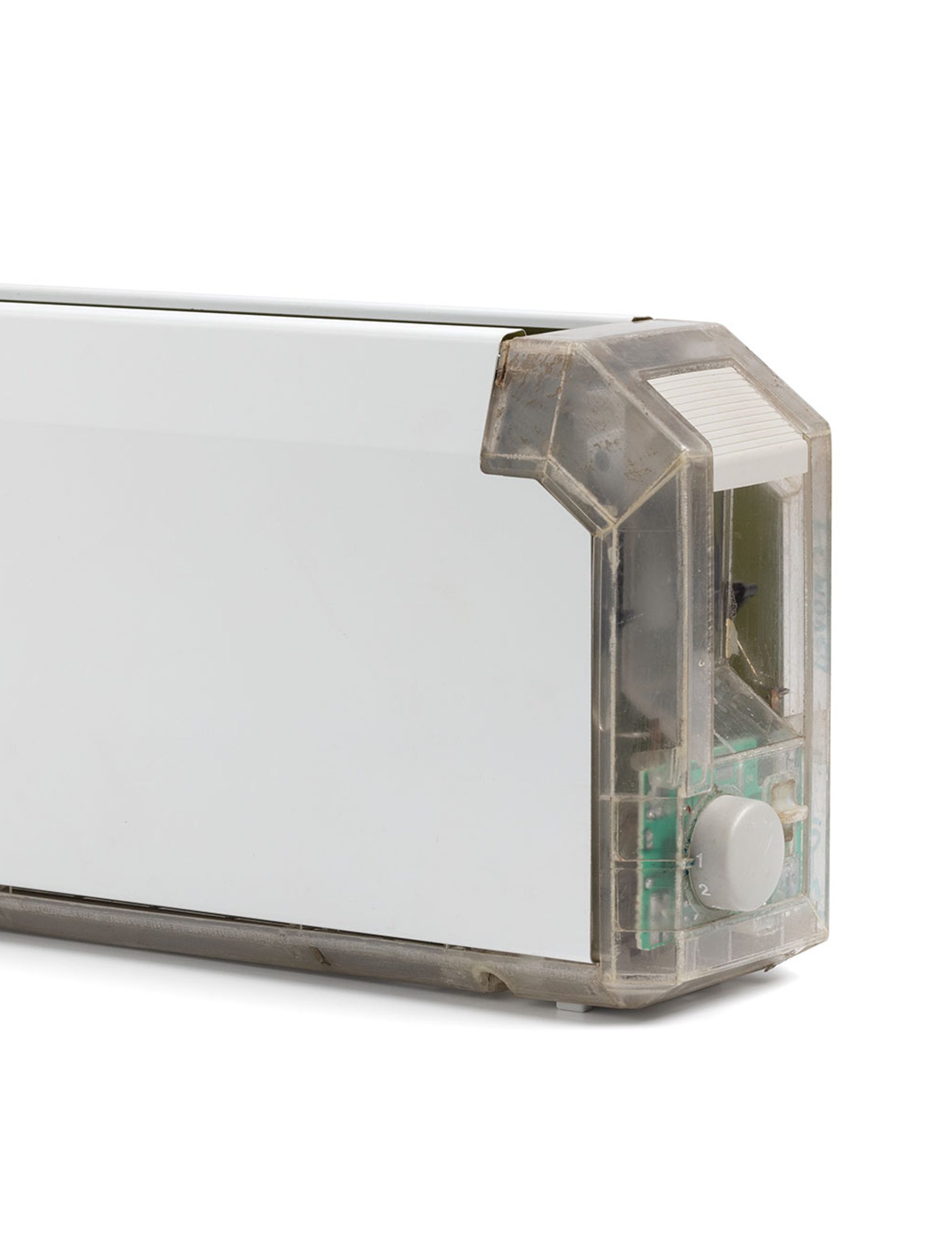 A long and thin white toaster with a clear end showing the internal mechanisms.
