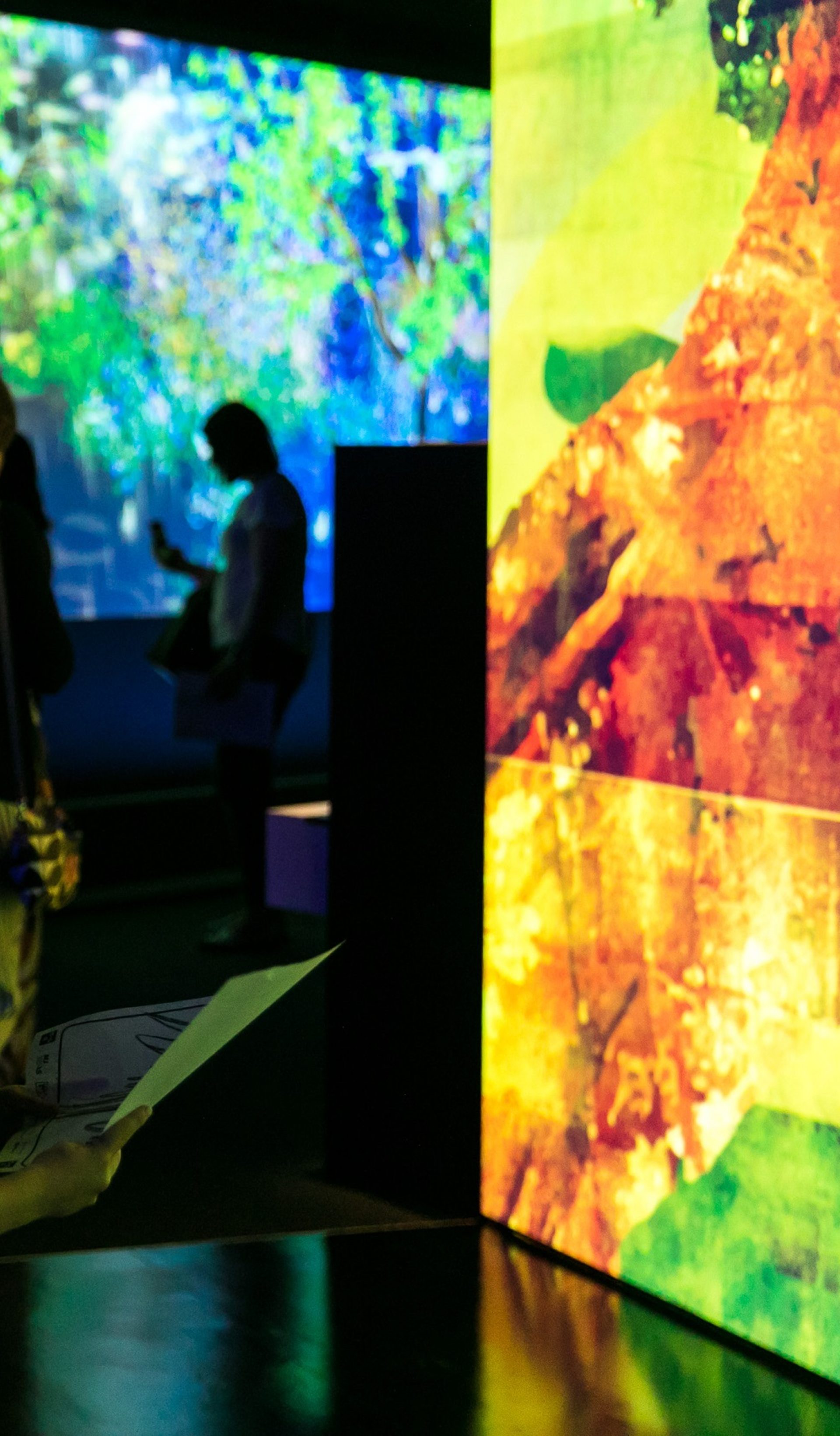 Family viewing audio visuals on display
