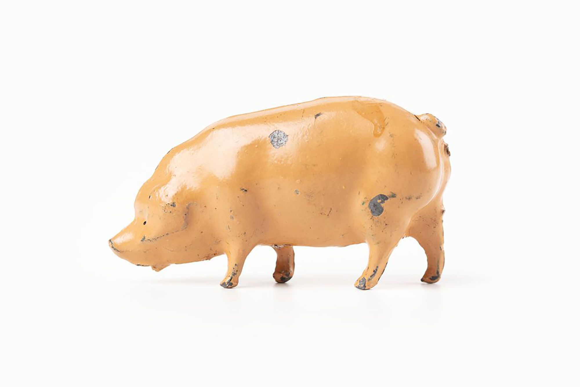 Small toy pig, light pink in colour.