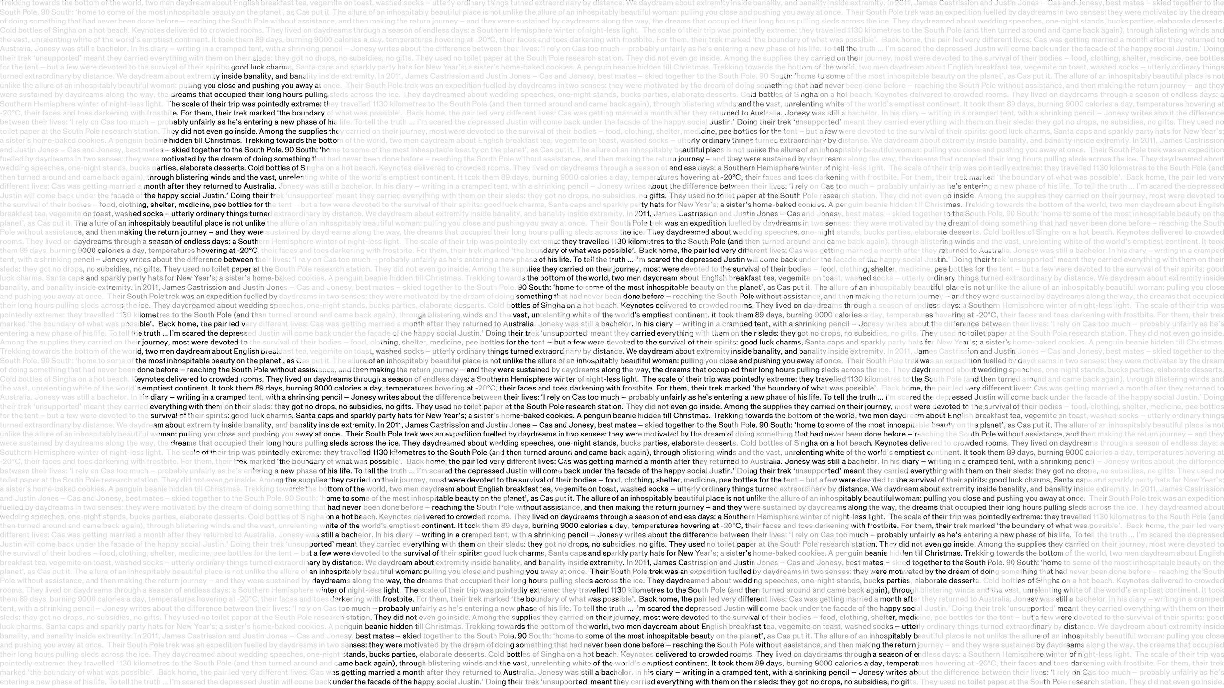 Two figures pose for a photo in snow gear.