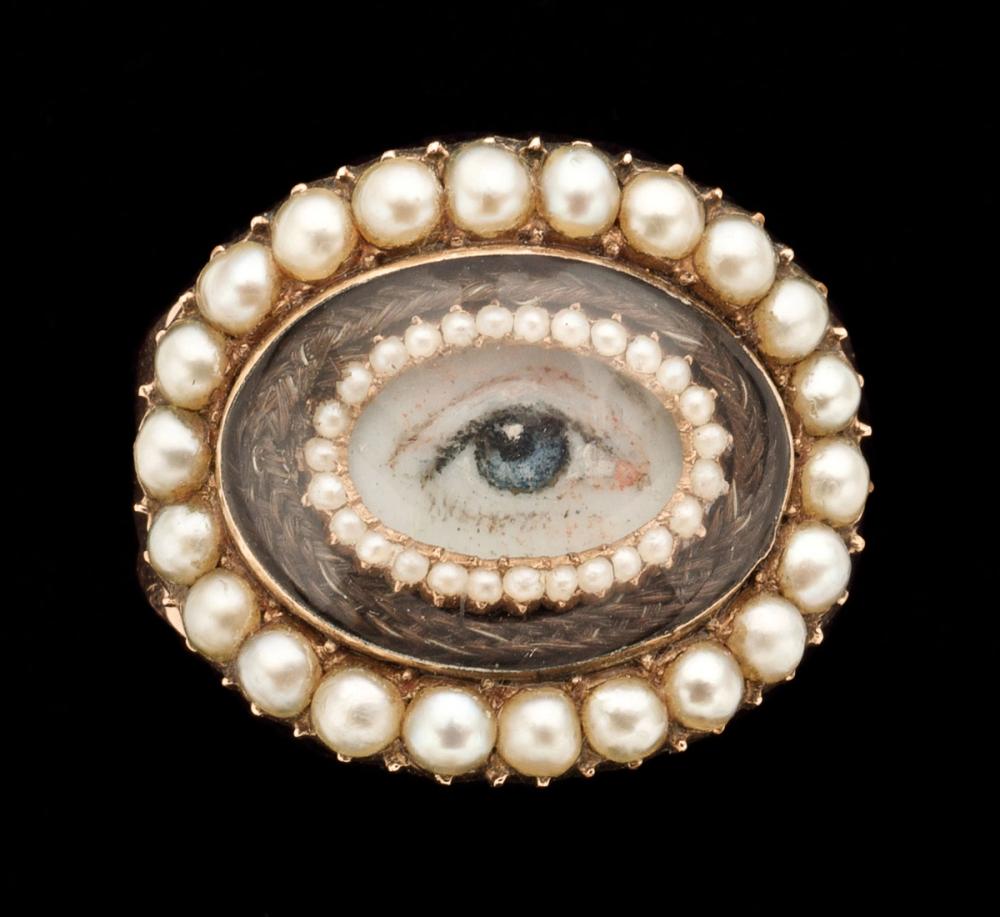 A ring with an eye miniature. Made out of gold, ivory, pearls and hair.