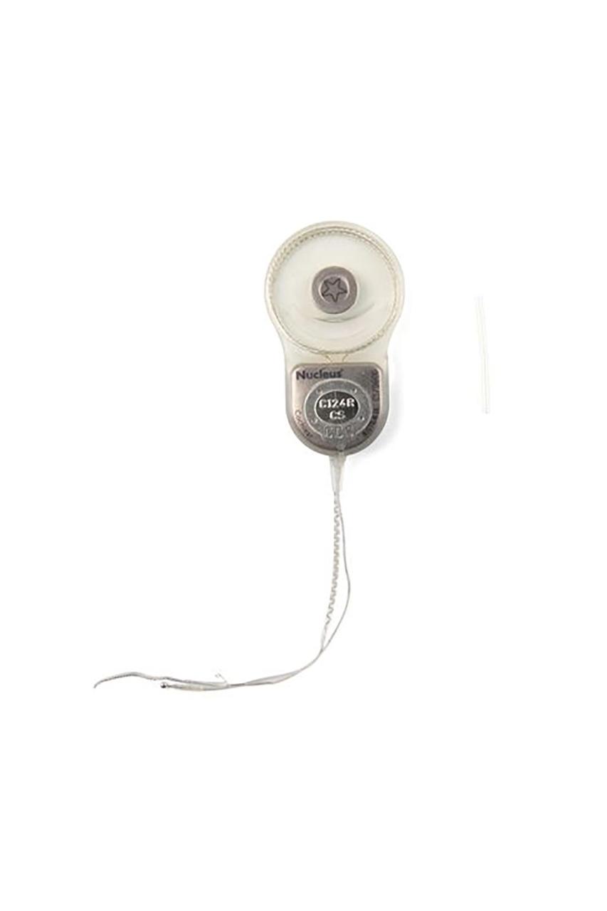 Grey cochlear implant photographed against white background