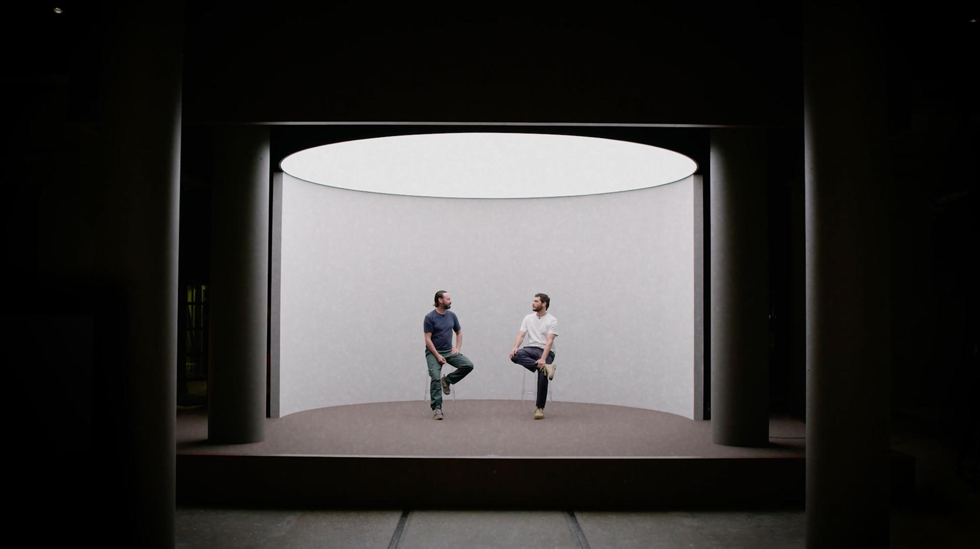 Rhys Ripper and Nathan McGuire sit on a stage in the Powerhouse talking to one another.