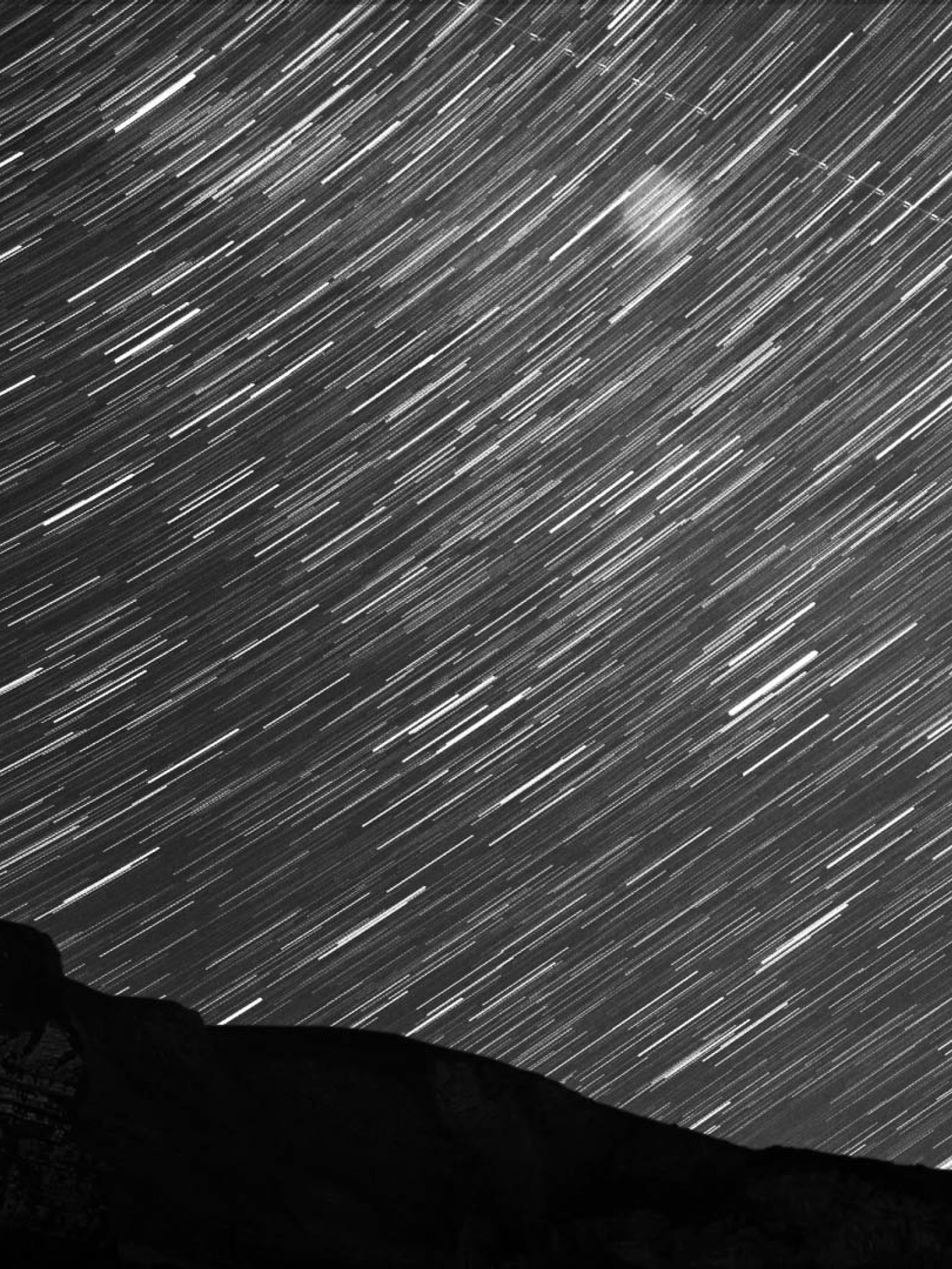 Mountains with star trail.