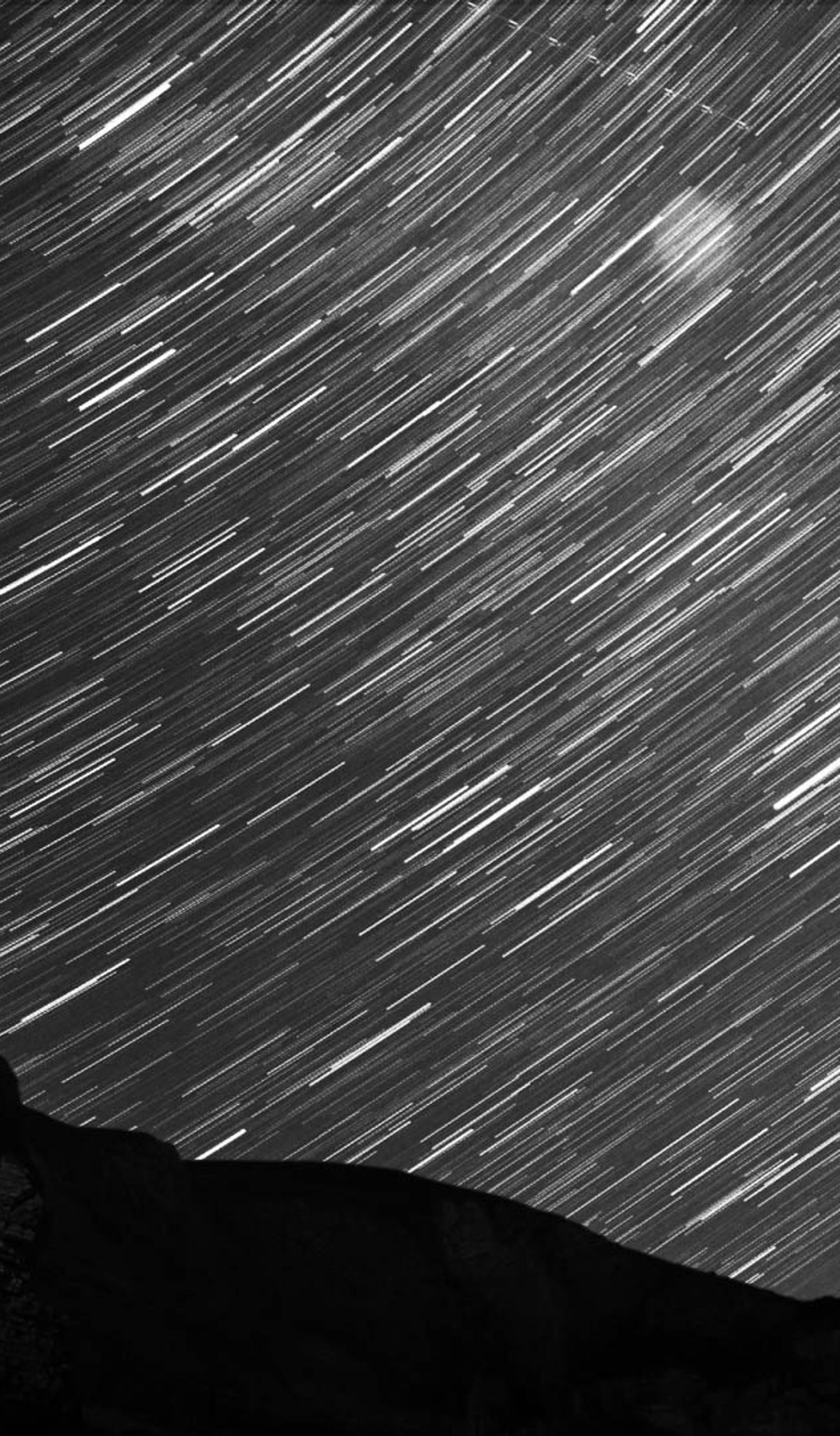 Mountains with star trail.