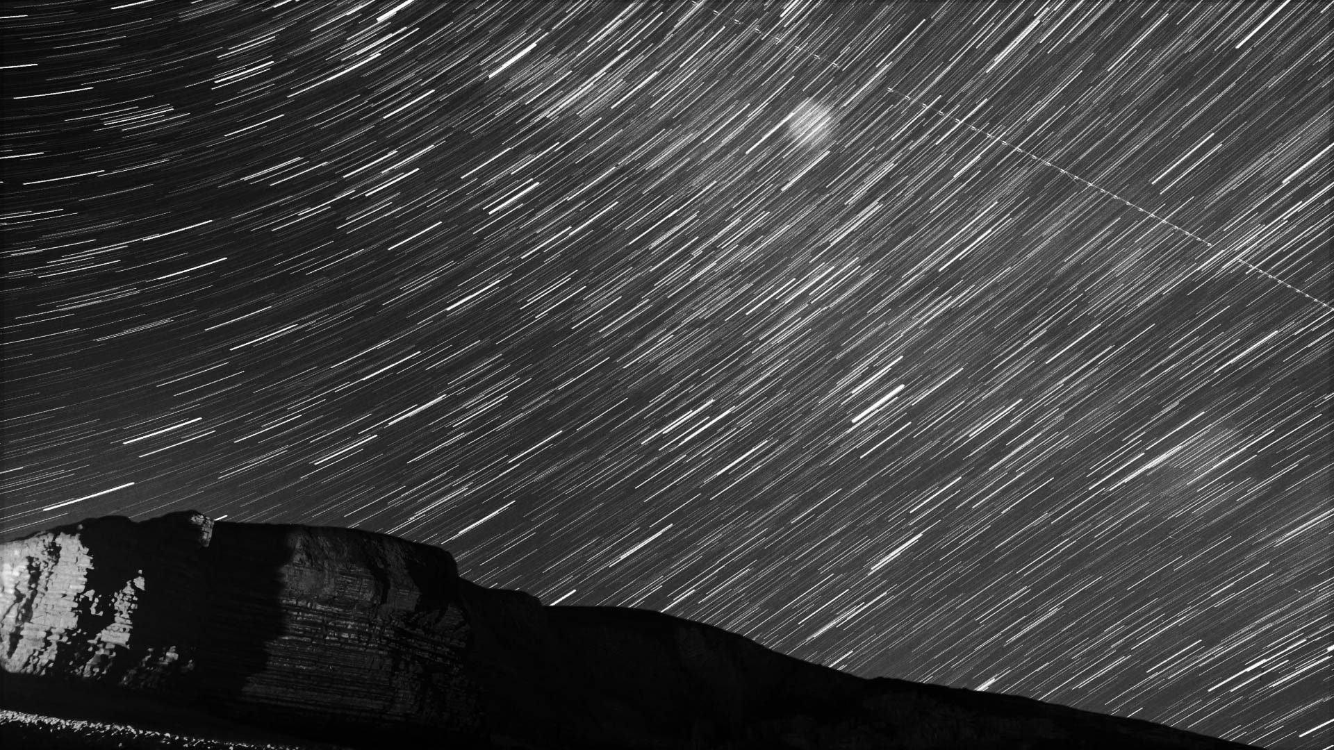 Mountains with star trail.