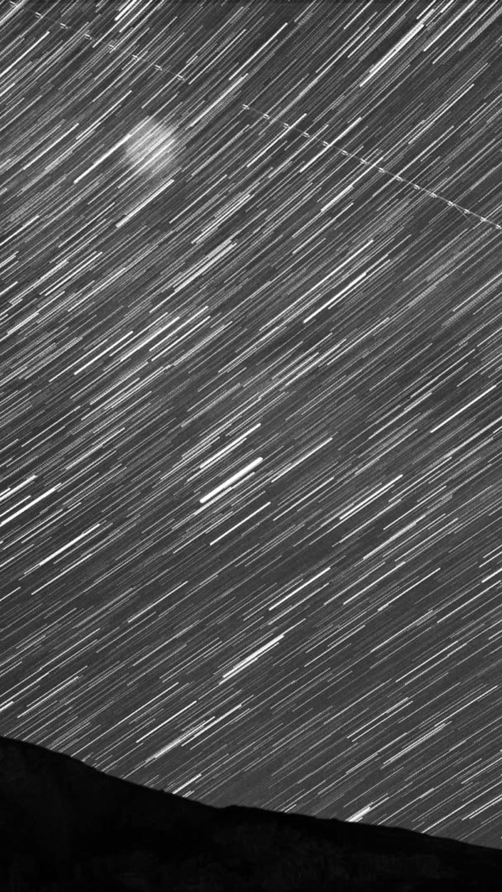 Mountains with star trail.