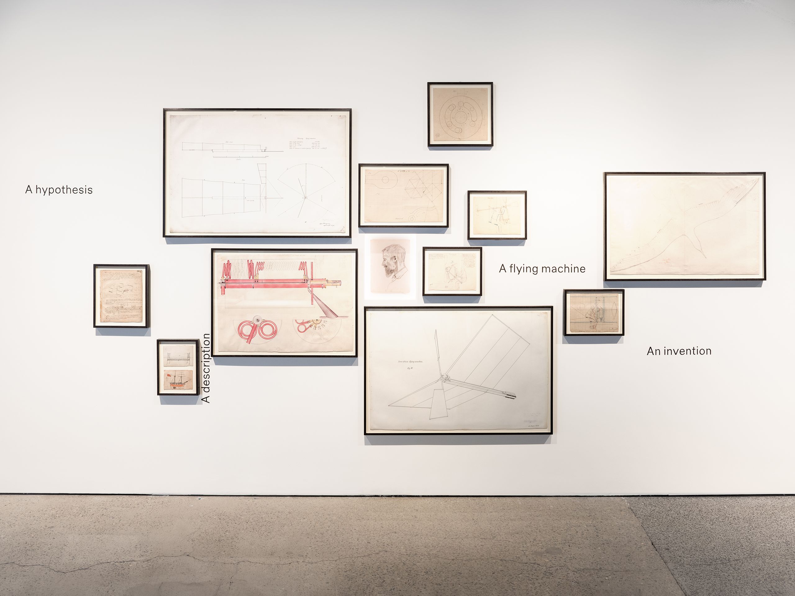 Frames on a wall filled with drawings