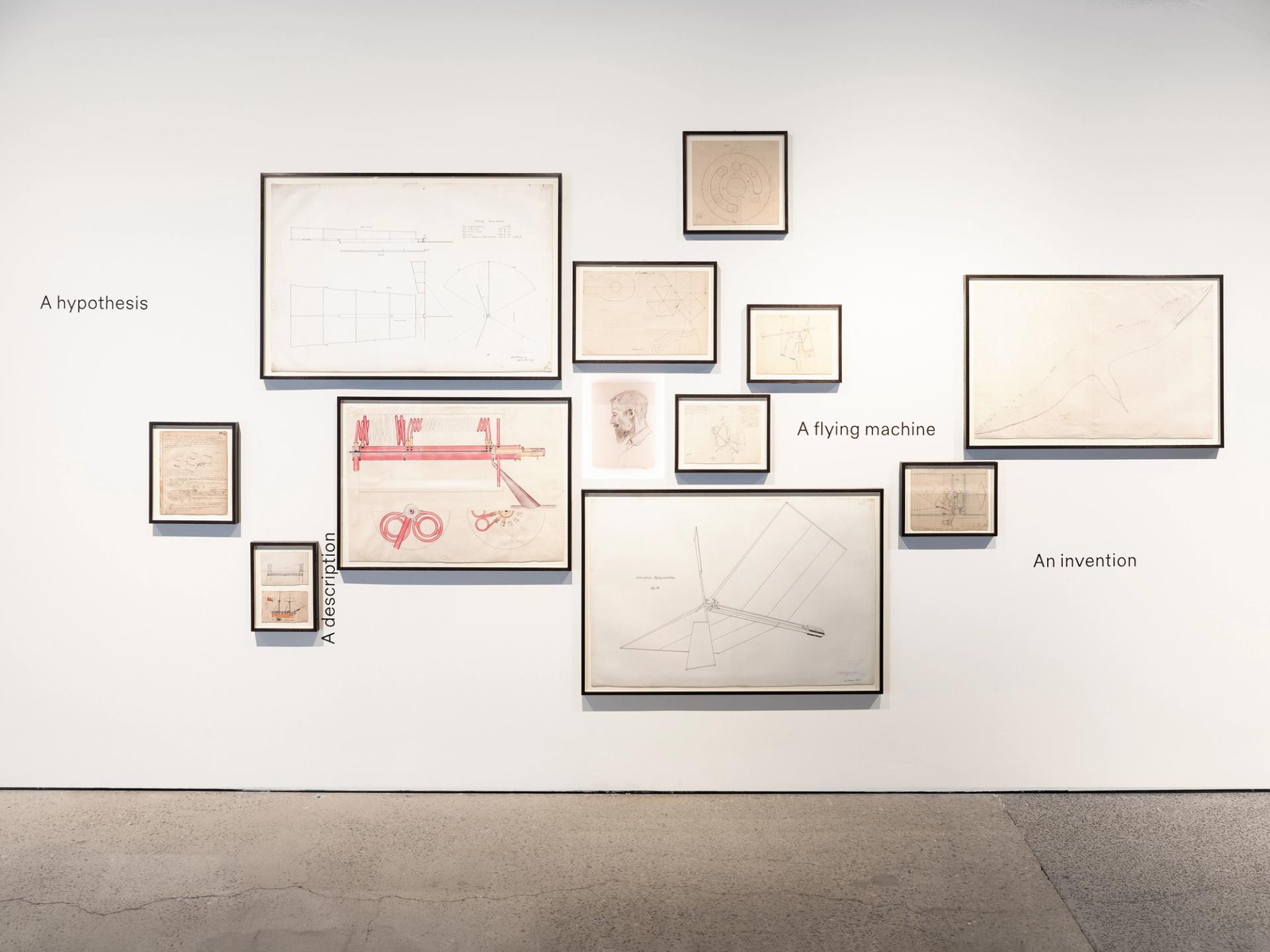 Frames on a wall filled with drawings