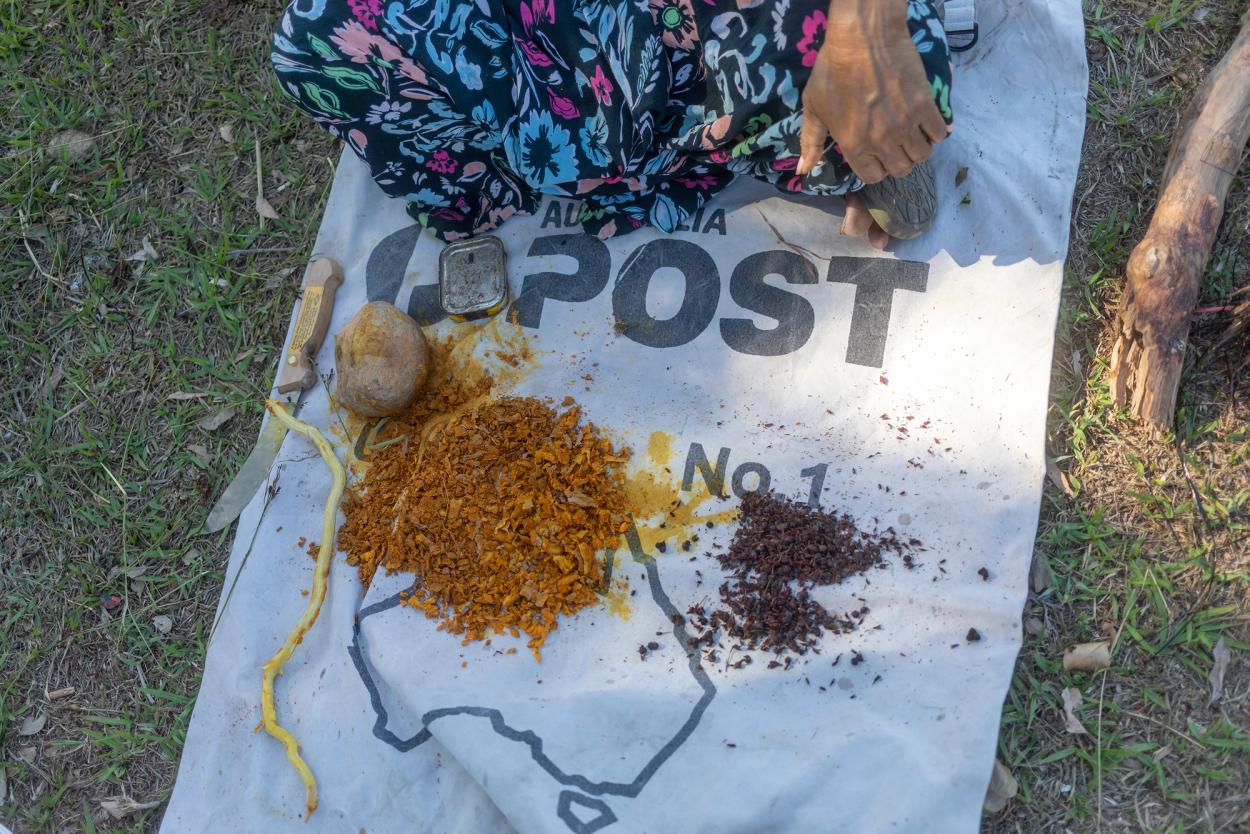 Yellow and Brown dyes, on a post bag on the ground.