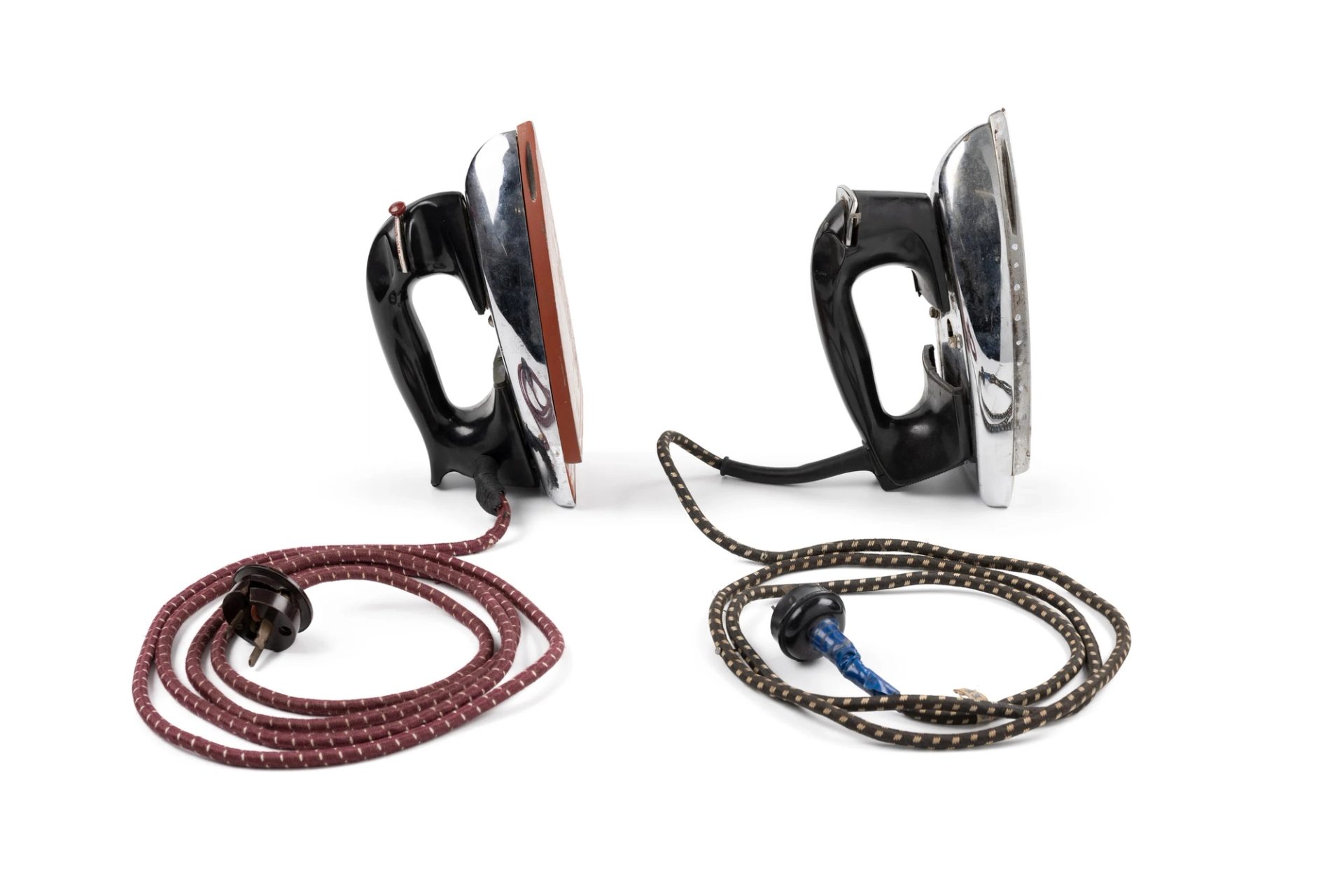 Two irons sitting side by side.