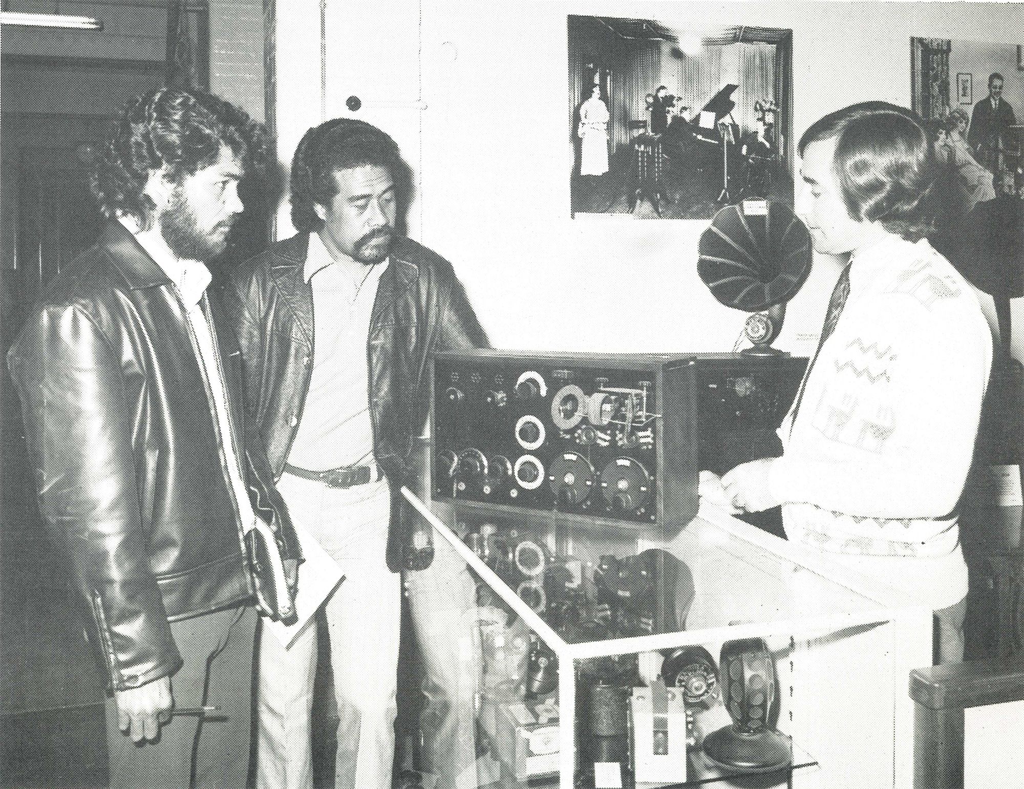 Six people exchanging a piece of paper