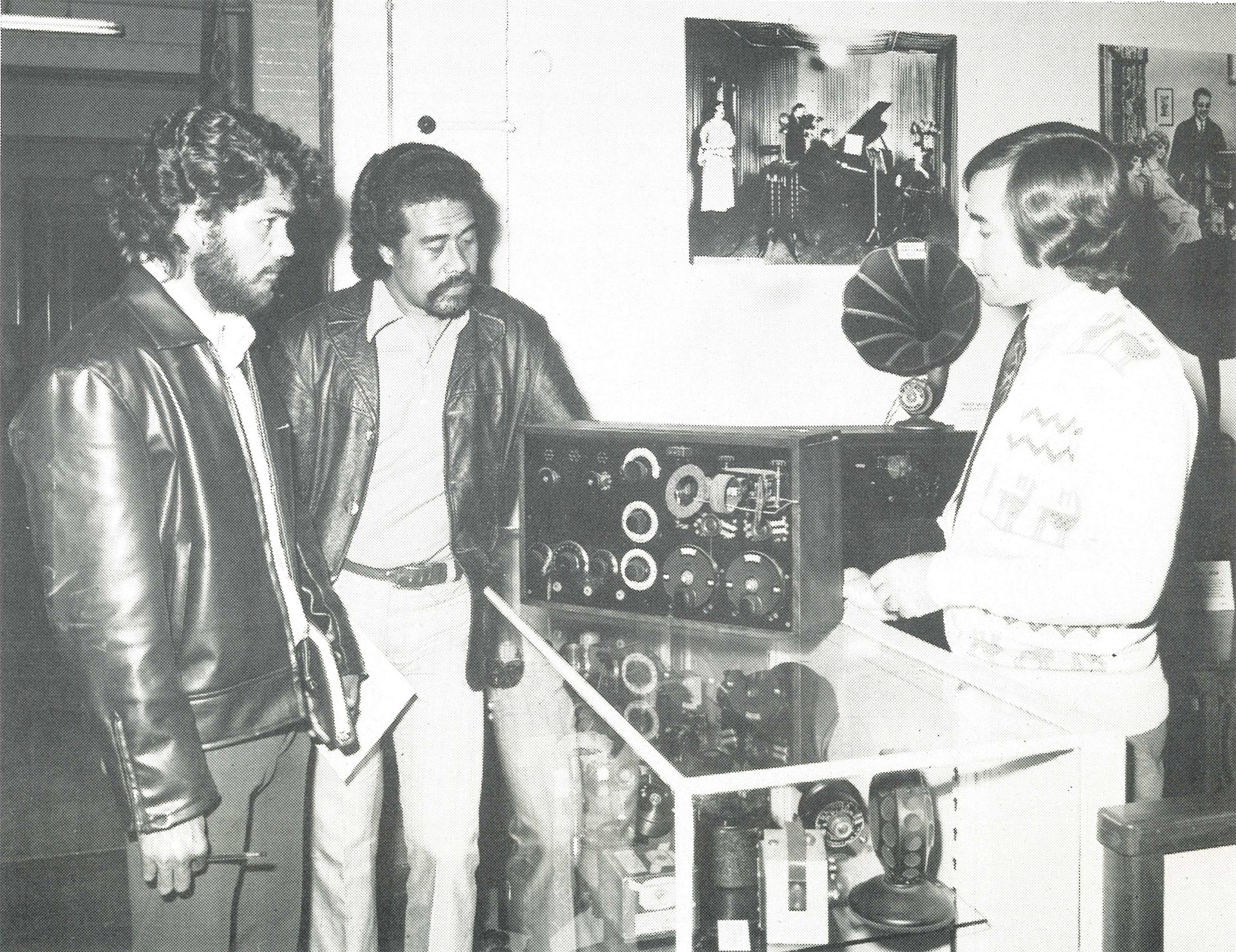 Six people exchanging a piece of paper