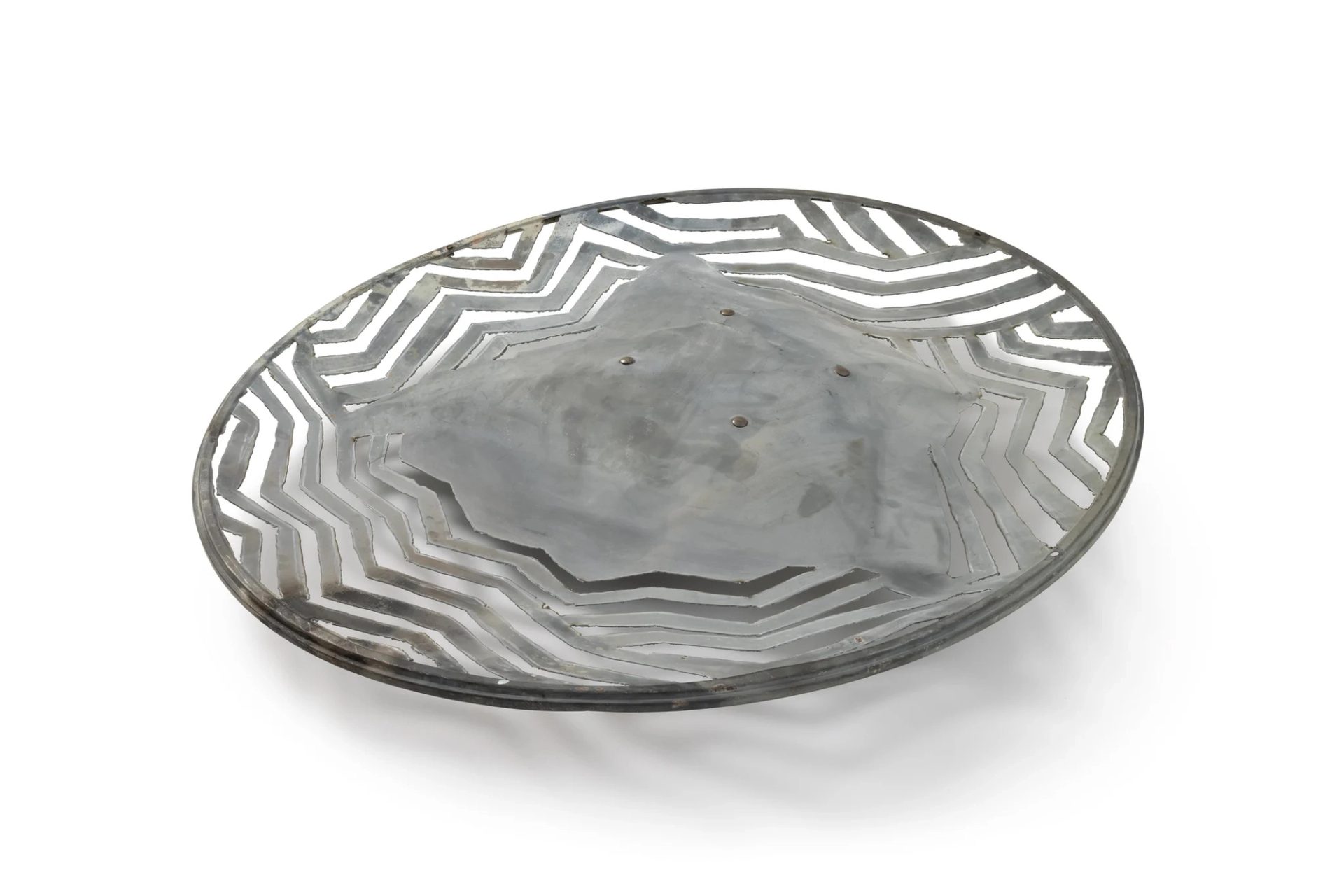 Satellite dish made out of patterned metal.