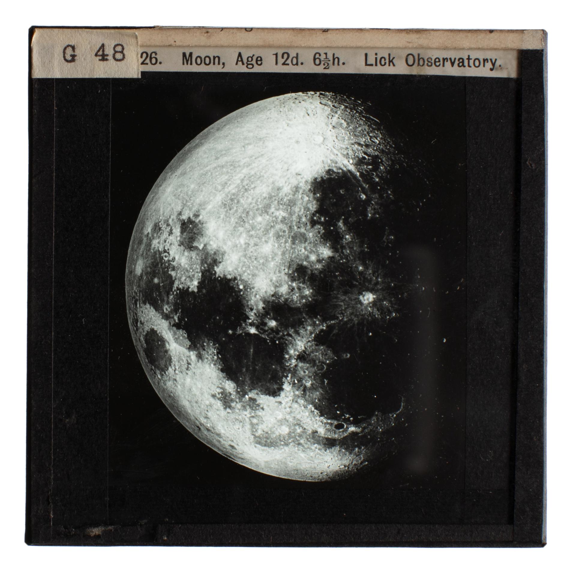 Photograph of a glass lantern slide used for teaching astronomy depicting the Moon at 12 1/2 days and 6 1/2 hours from the Lick Observatory.