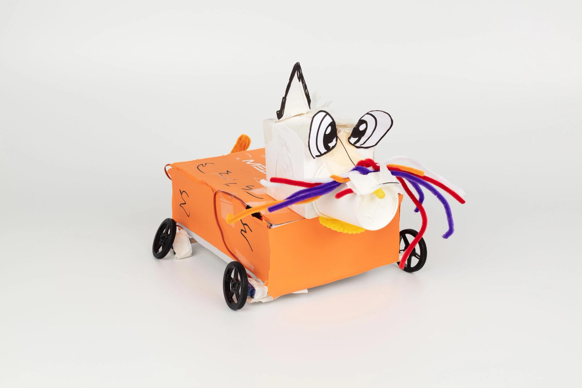 Image of a hand crafted mechanical device against a white background.