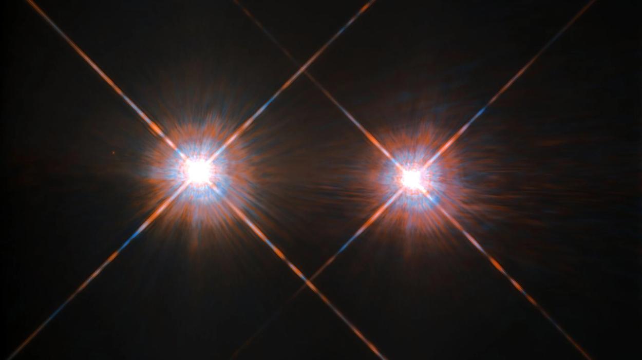 This NASA/ESA Hubble Space Telescope has given us this stunning view of the bright Alpha Centauri A (on the left) and Alpha Centauri B (on the right), shining like huge cosmic headlamps in the dark. The image was captured by the Wide-Field and Planetary Camera 2 (WFPC2). WFPC2 was Hubble’s most used instrument for the first 13 years of the space telescope’s life, being replaced in 2009 by Wide-Field Camera 3 (WFC3) during Servicing Mission 4. This portrait of Alpha Centauri was produced by observations carried out at optical and near-infrared ...more