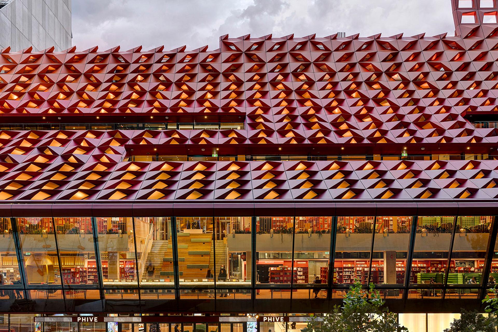 The red rooftop of Phive, featuring small undulations, that create a wavey pattern across the building.
