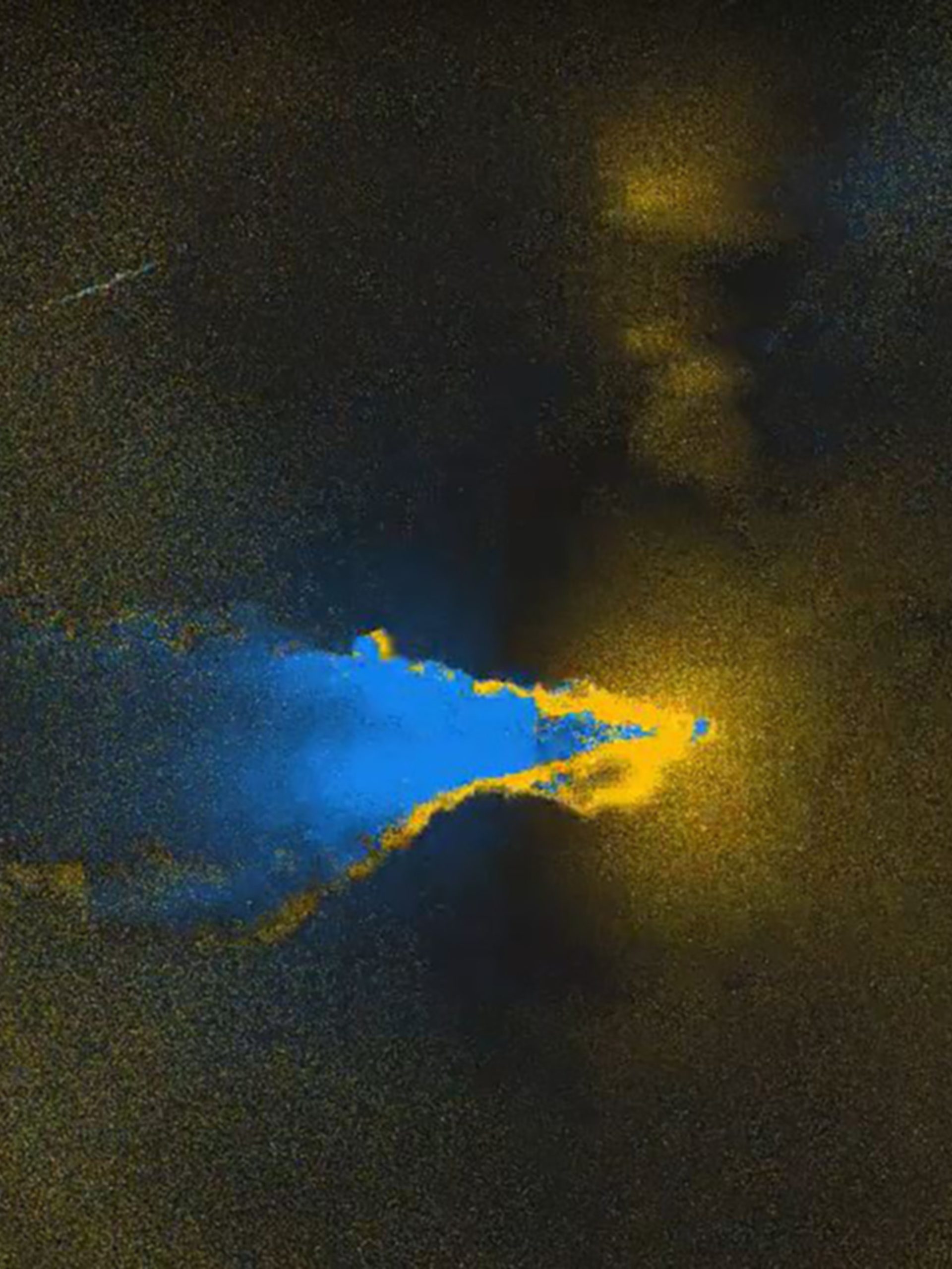 Yellow rings faded into darkness, with a blue cloud flowing left out of frame.