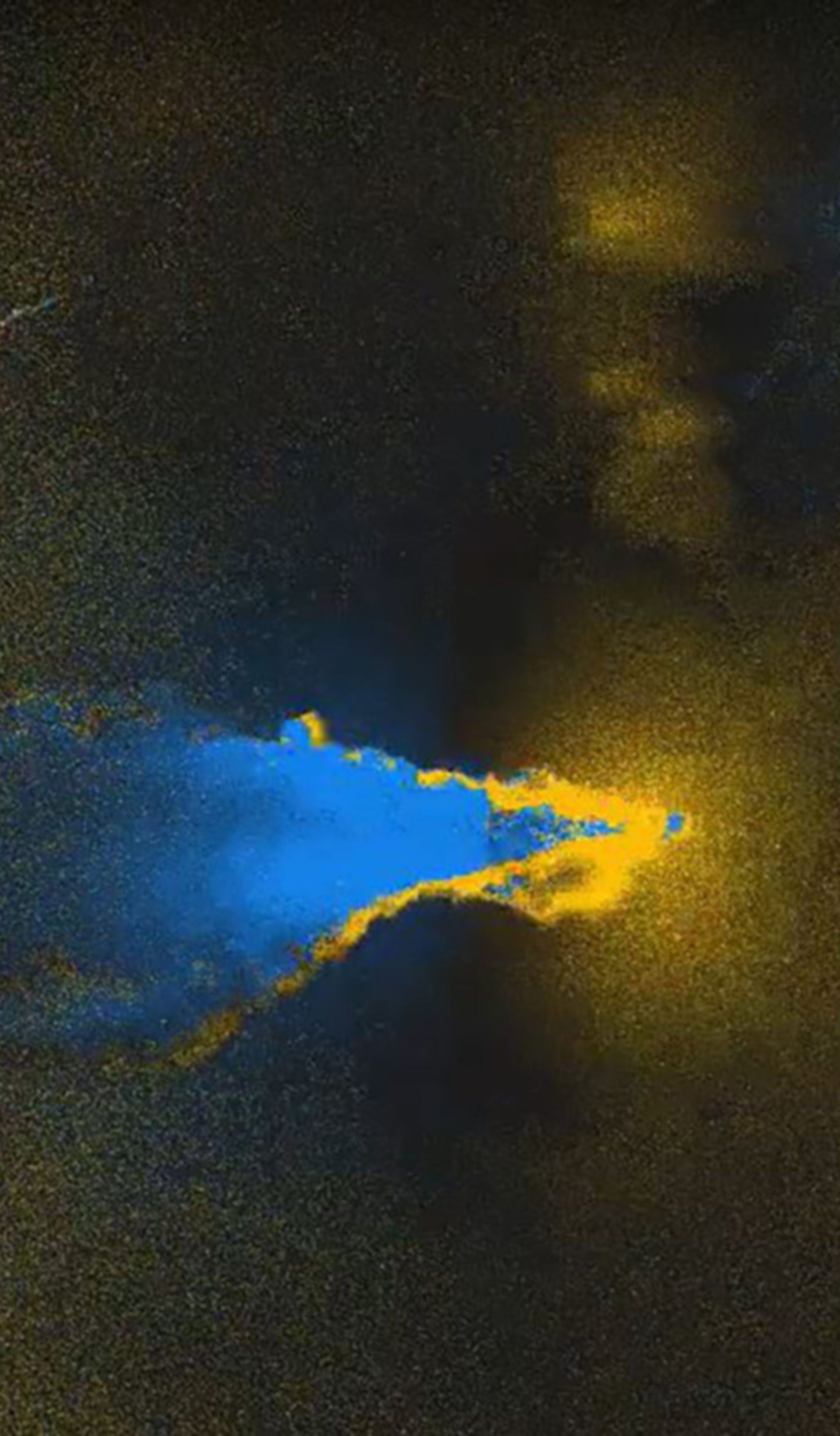Yellow rings faded into darkness, with a blue cloud flowing left out of frame.