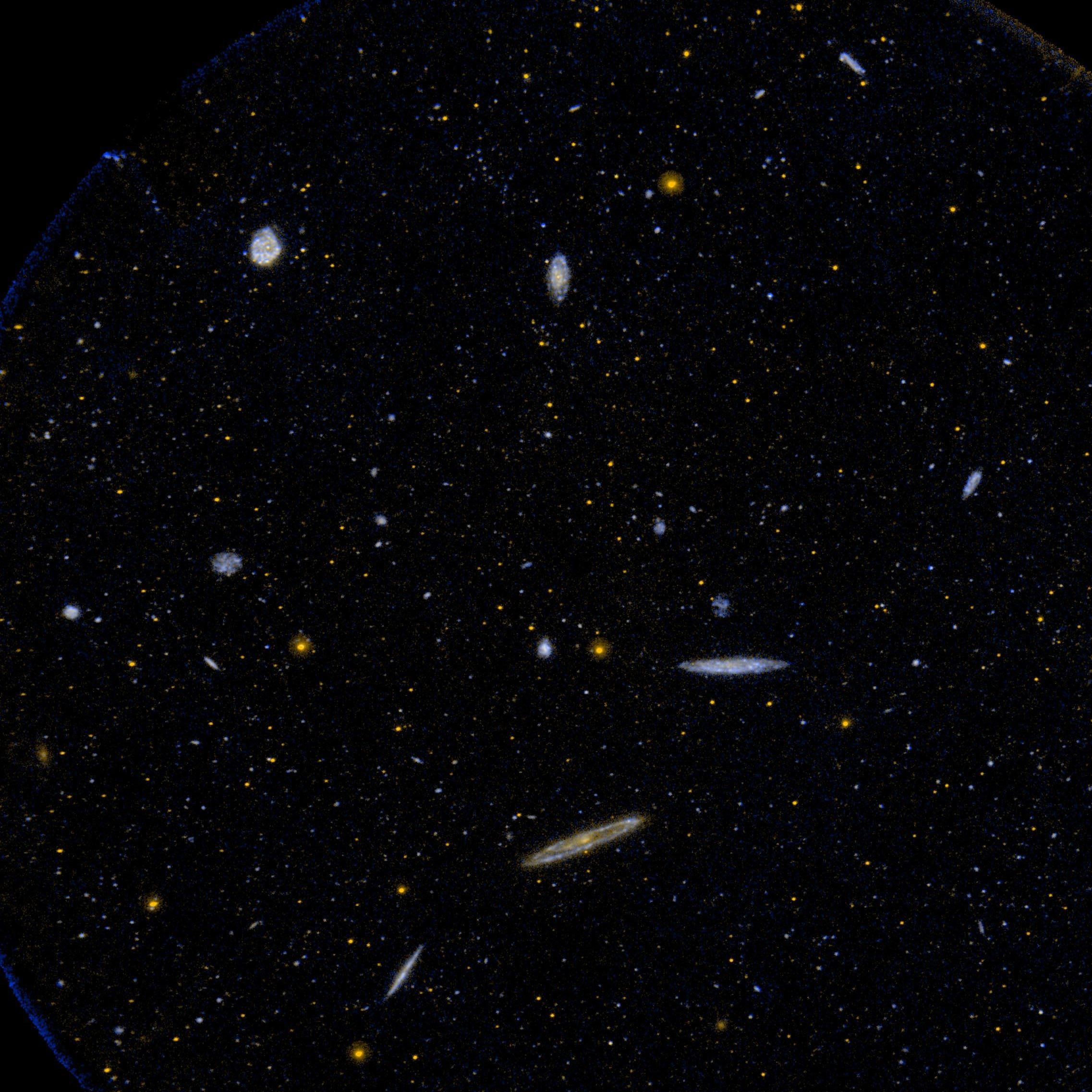An ultraviolet image of space from NASA Galaxy Evolution Explorer showing a small area of the Virgo Cluster of galaxies.