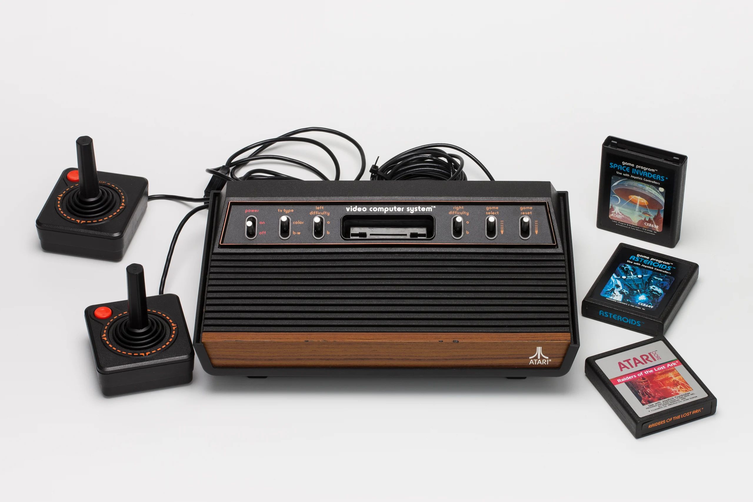 Joy sticks and 80s video computer system with games.