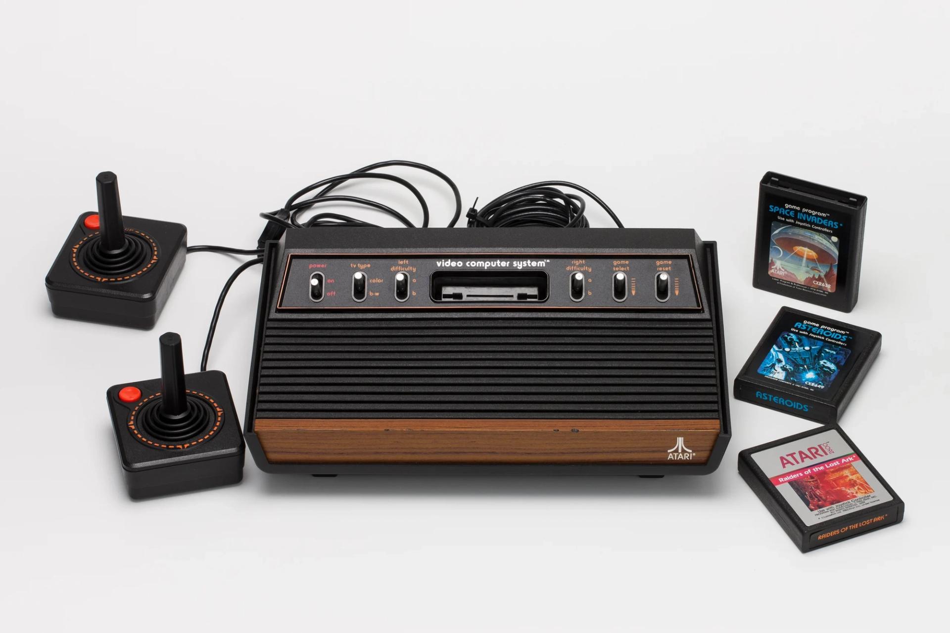 Joy sticks and 80s video computer system with games.