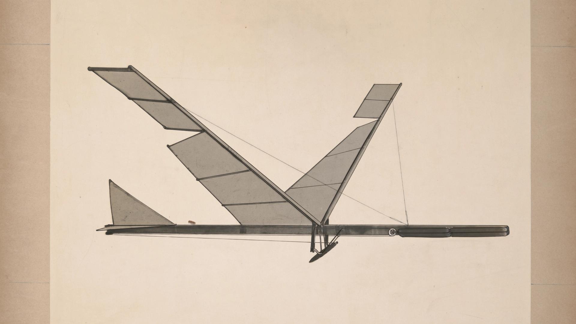 A black & white photograph depicting a rubber band flapping wing flying machine.