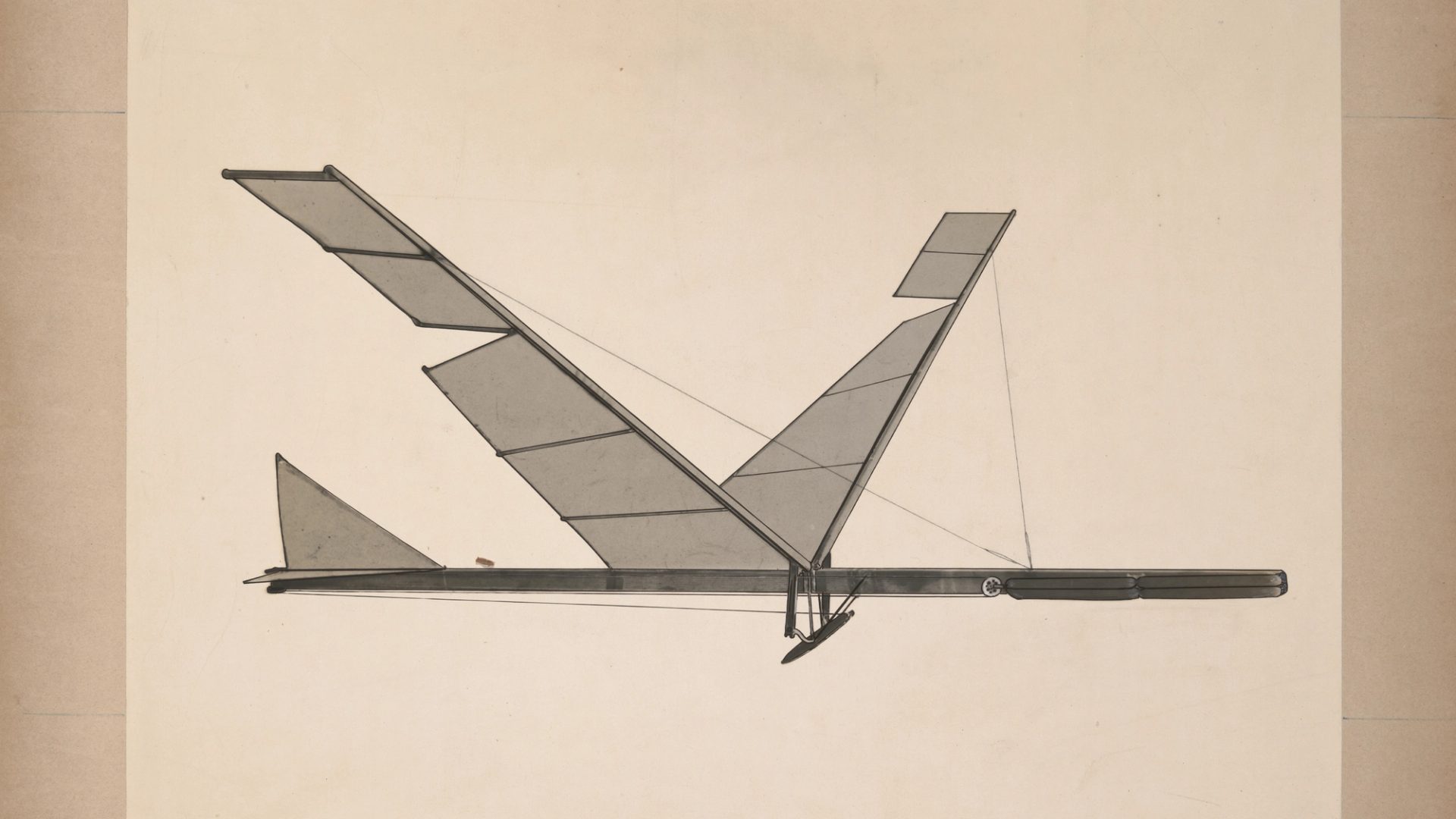 A black & white photograph depicting a rubber band flapping wing flying machine.