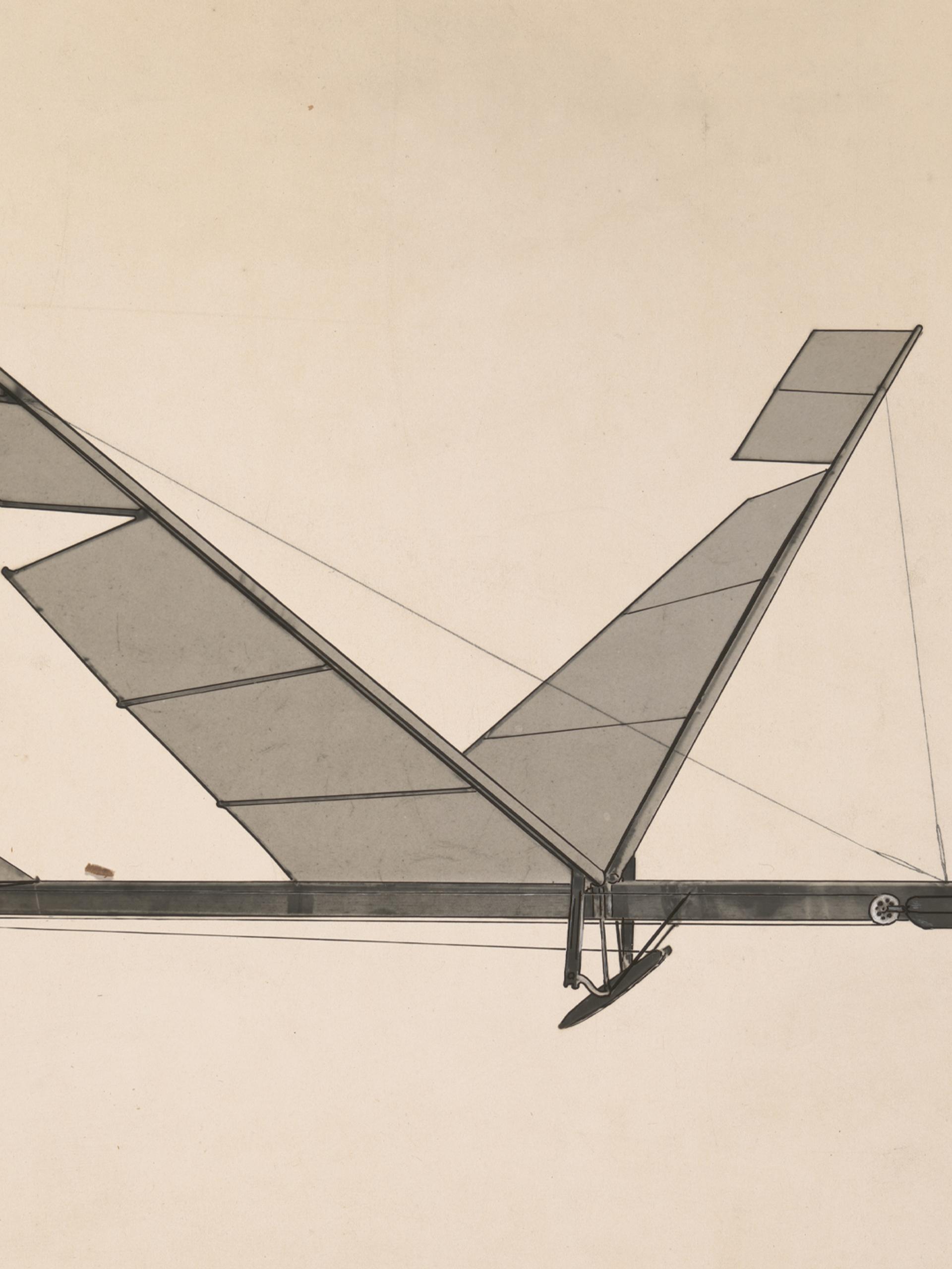 A black & white photograph depicting a rubber band flapping wing flying machine.