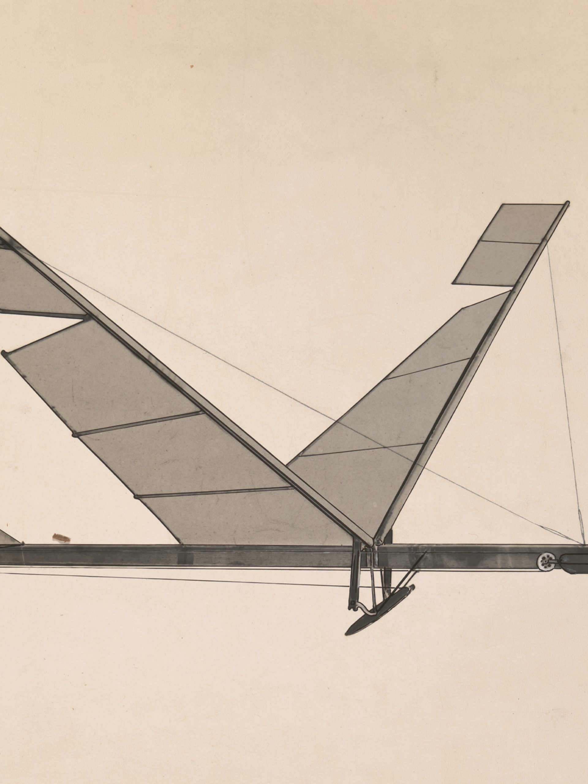 A black & white photograph depicting a rubber band flapping wing flying machine.