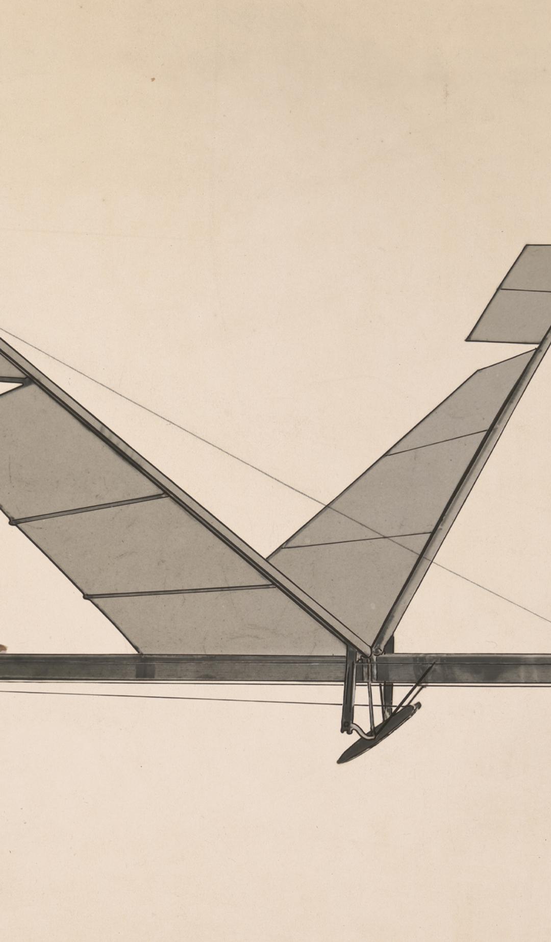 A black & white photograph depicting a rubber band flapping wing flying machine.