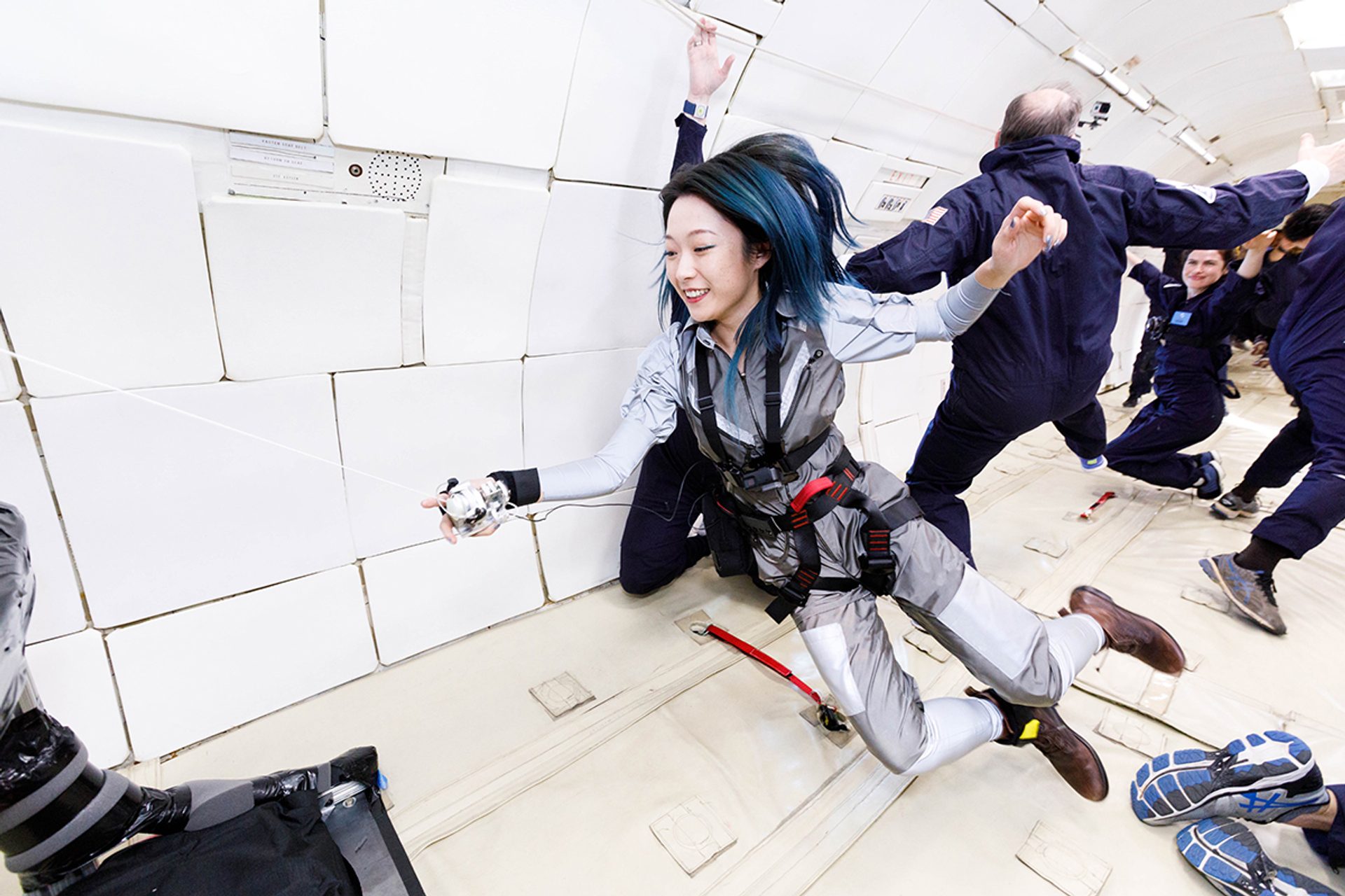 Floating humans in a white room.