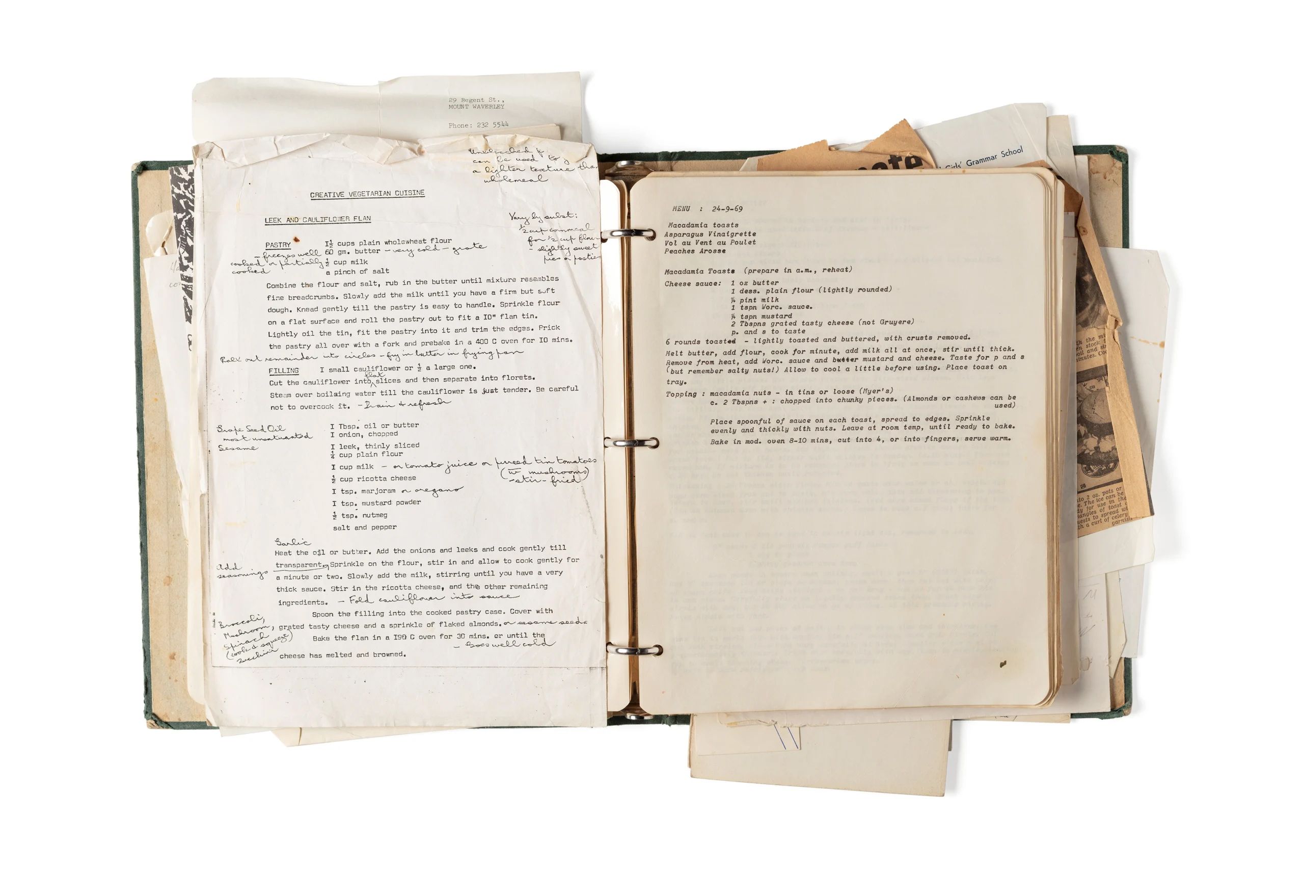 Overflowing folder with yellowing paper and type on a page.