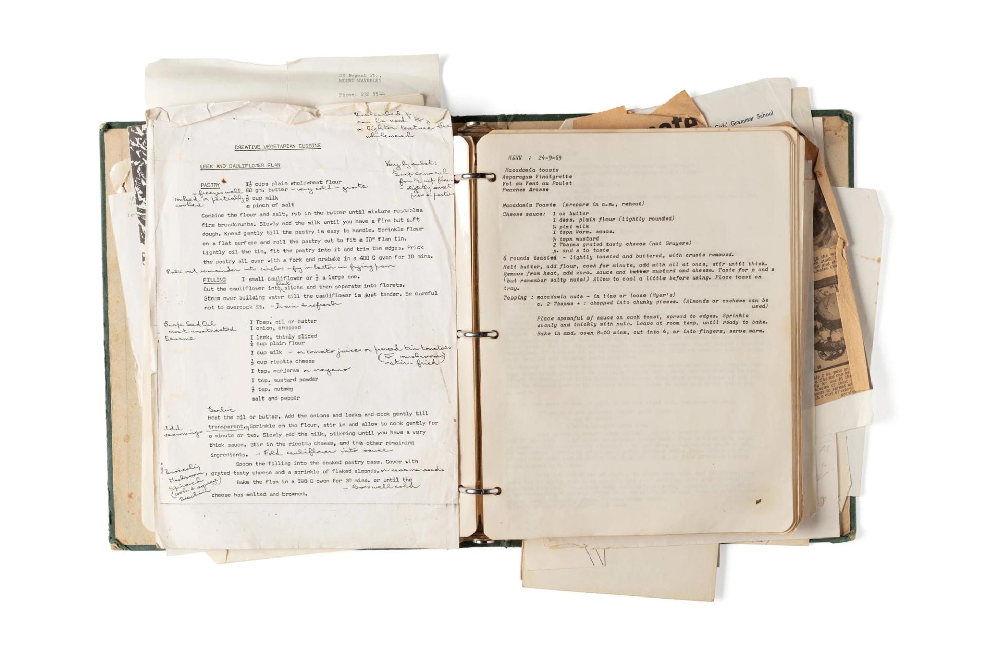 Overflowing folder with yellowing paper and type on a page.
