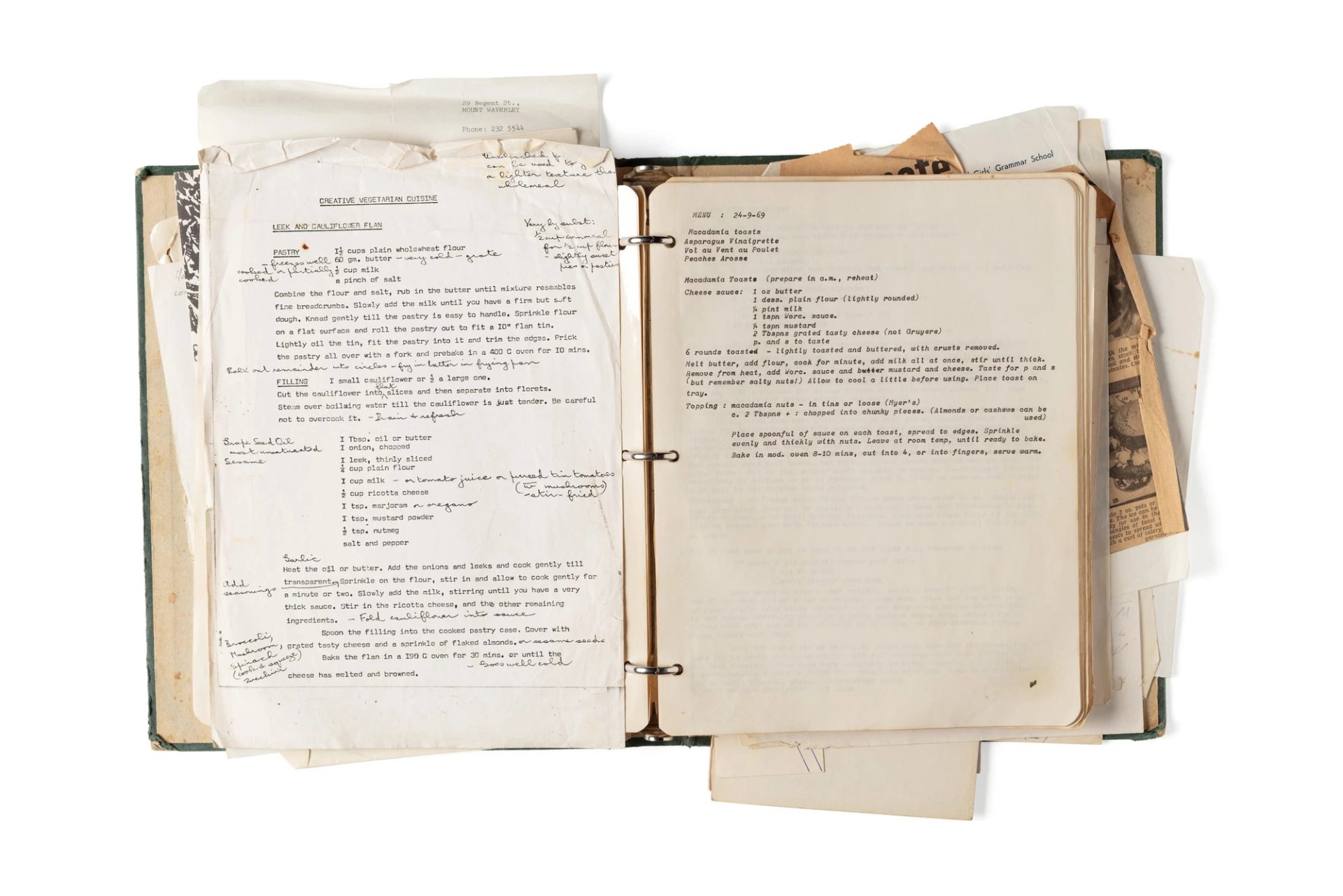 Overflowing folder with yellowing paper and type on a page.