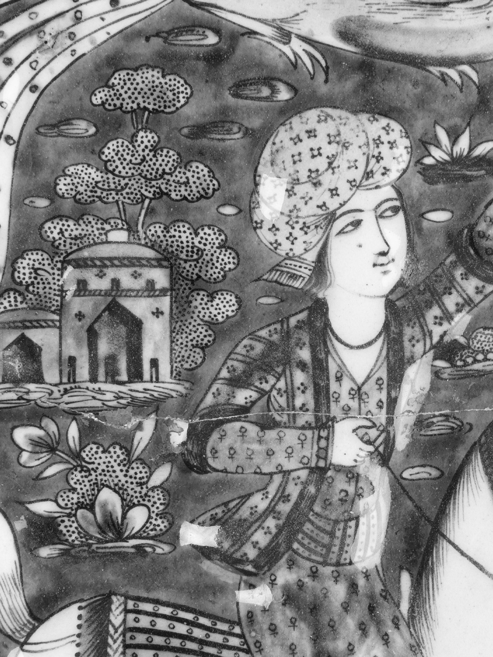 A rectangular glazed tile is painted in cobalt-blue, turquoise, manganese and pink with a black outline on a white ground and was made for the decoration of the wall of an internal reception hall, the external wall of a castle or the house of an aristocratic Qajar family.